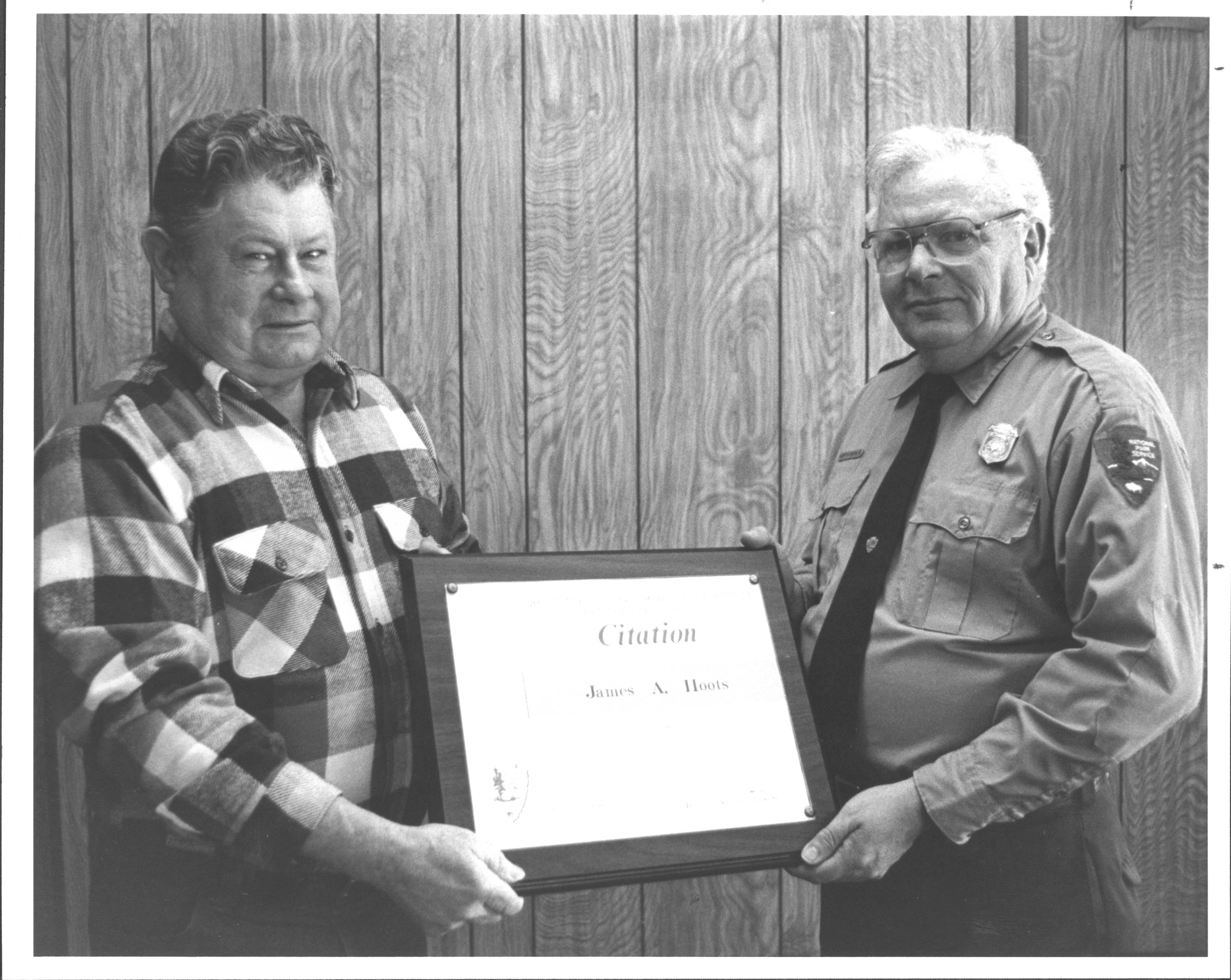 Supt. Al Banton presents a citation to maintenance worker/grounds keeper James Hoots. awards, staff, Maintenance