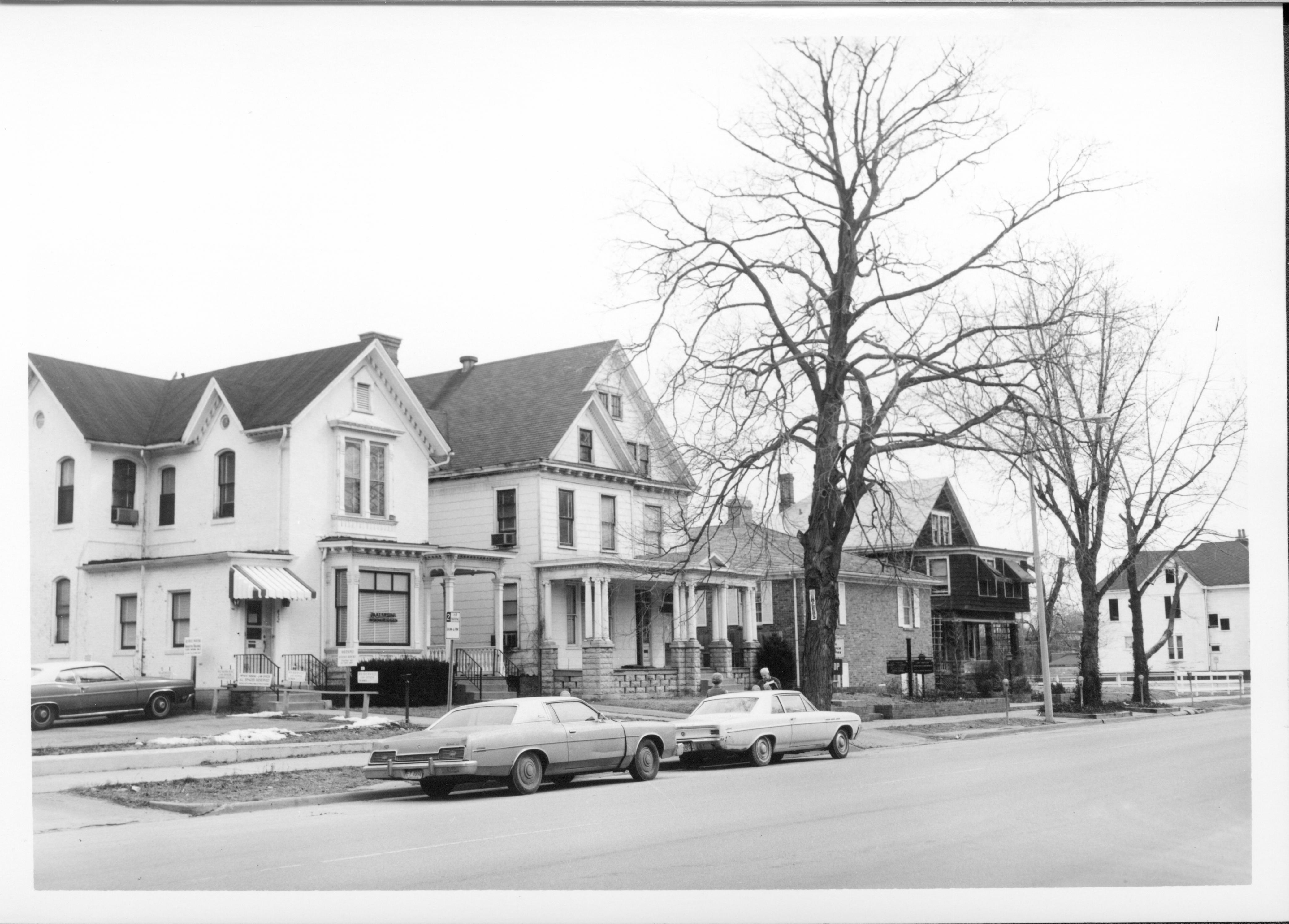 Home and office of Dr. Albert T. Kwedar (far left) on Block 7, Lot 4, on 7th Street, now location of Visitor Center Looking Southeast on 7th Street, south of Capitol. Visitor Center, parking lot, 7th Street, Kwedar