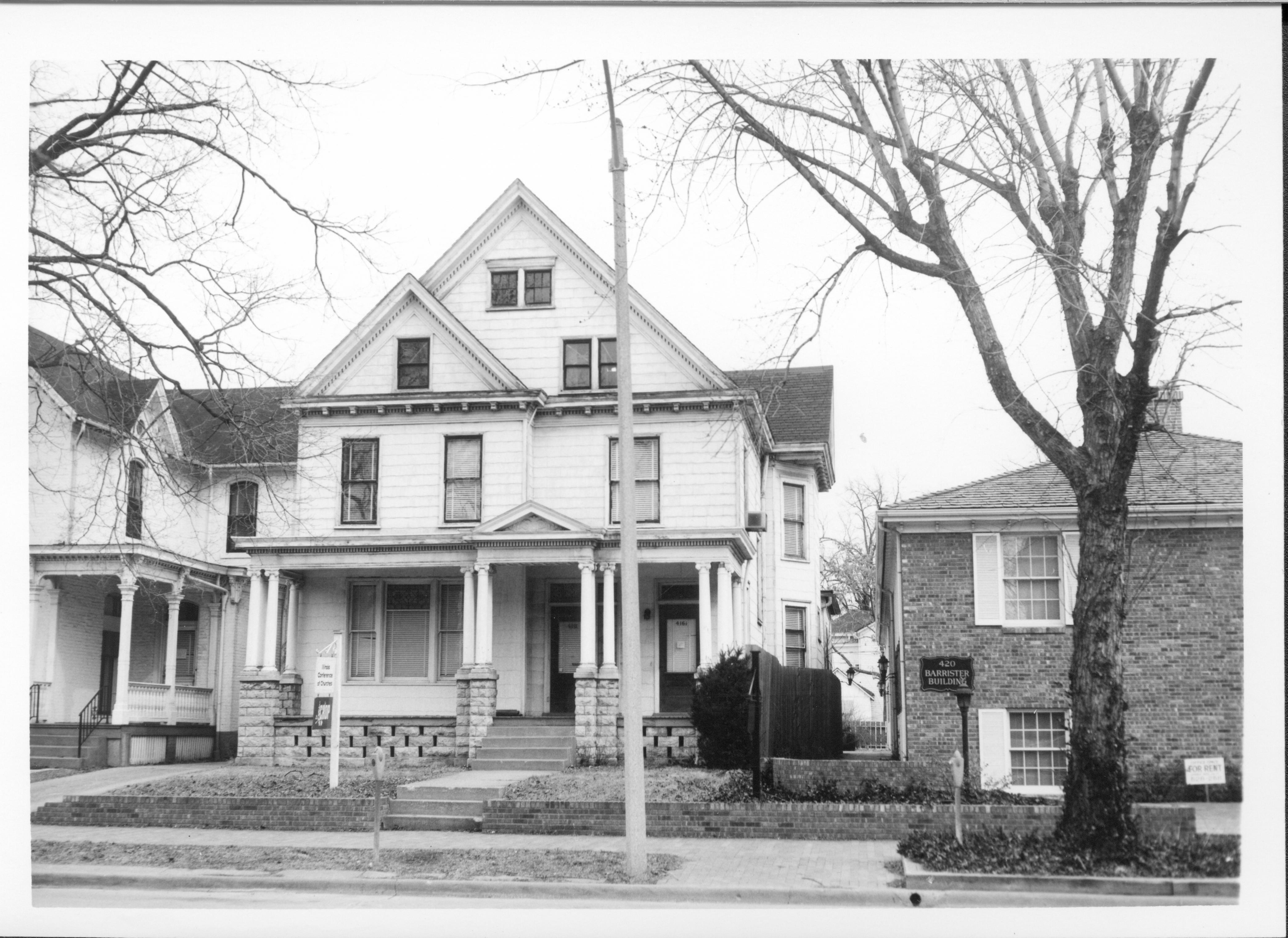House belonging to Eugene McNally serving as office of the Illinois Council of Churches and CROP, Block 7, Lot 5 along 7th Street. Area is now Visitor Center.  House belonging to Albert Kwedar on left, and Evelyn Grummon on right.  Looking East along 7th Street, south of Capitol Ave. Visitor Center, Kwedar, McNally, Grummon, 7th Street, Illinois Council of Churches