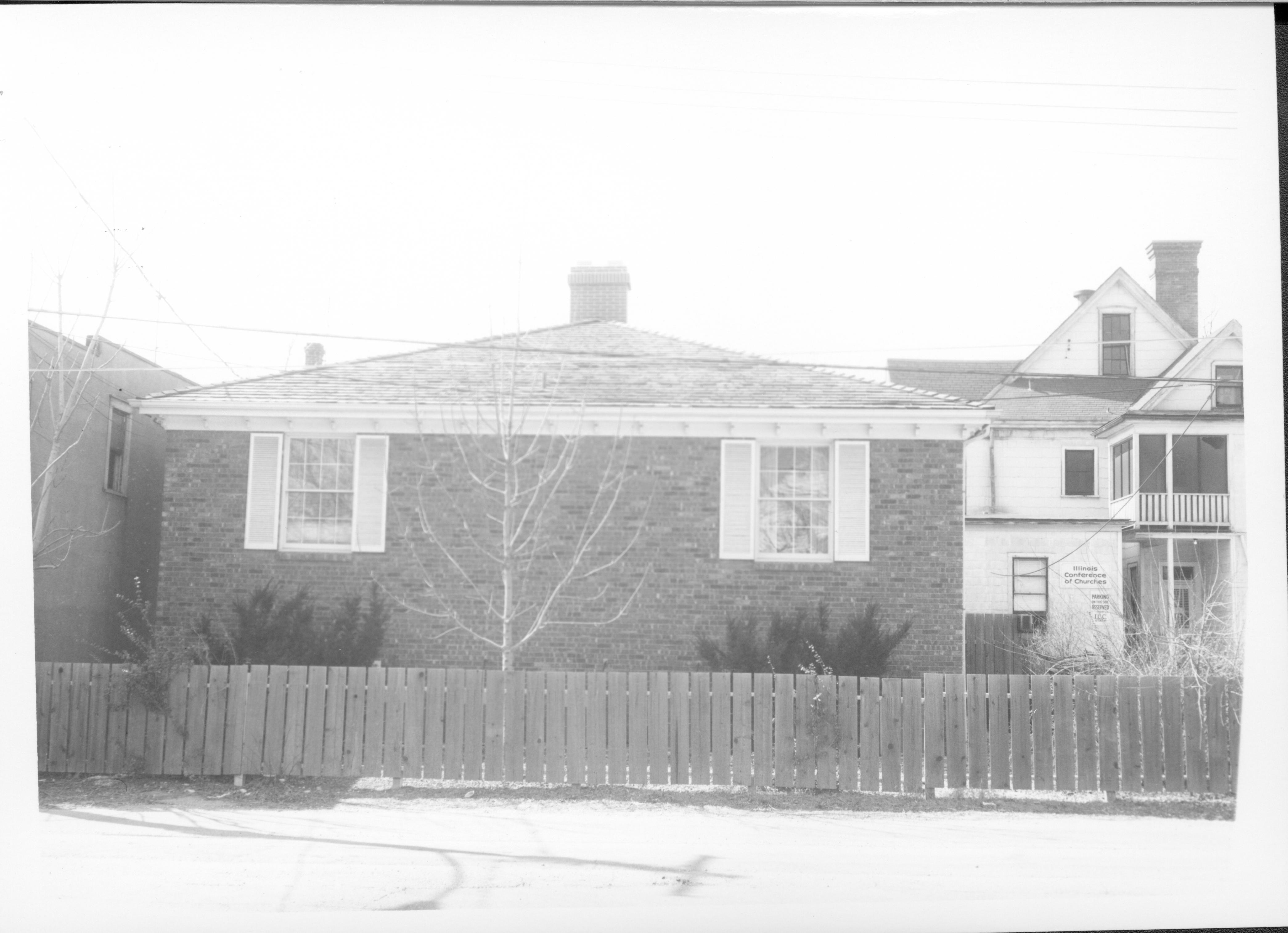 Building owned by Eveyln Grummon used by Springfield Marine Bank. Labeled as Barrister Building. Located on Block 7, Lot 6 along 7th Street.  House on right belonged to Eugene McNally Looking west from alley Springfield Marine Bank, Barrister Building, Visitor Center, McNally, Grummon