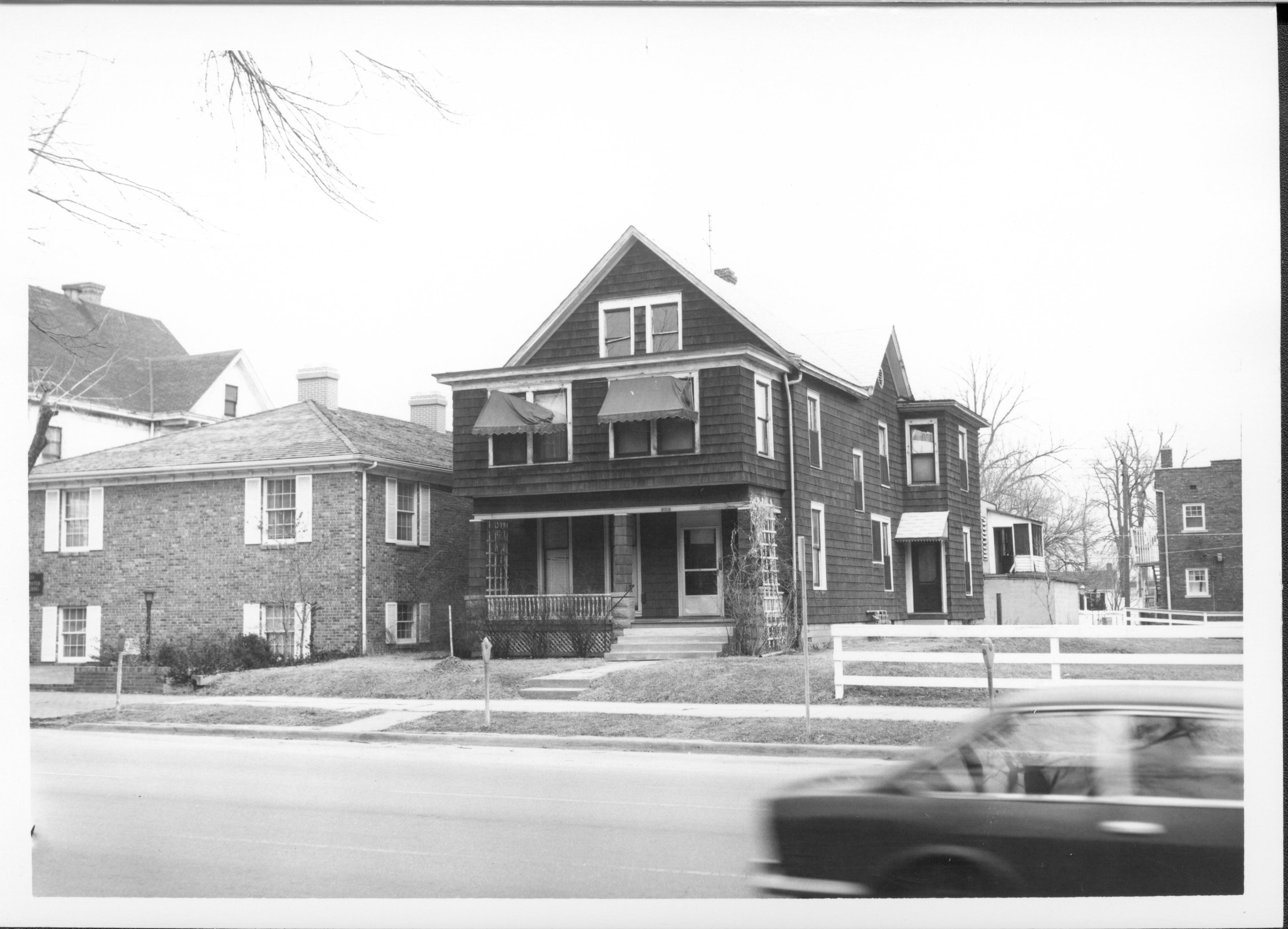House belonging to Eleanor J. Pruett, Block 7, Lot 7 along 7th Street where Visitor Center now stands.  Building on left belonged to Evelyn Grummon used by Springfield Marine Bank and labeled as the Barrister Building.  Apartment building on Burch lot seen on far right Looking East along 7th Street Pruett, Grummon, Visitor Center, 7th Street, Burch, apartment