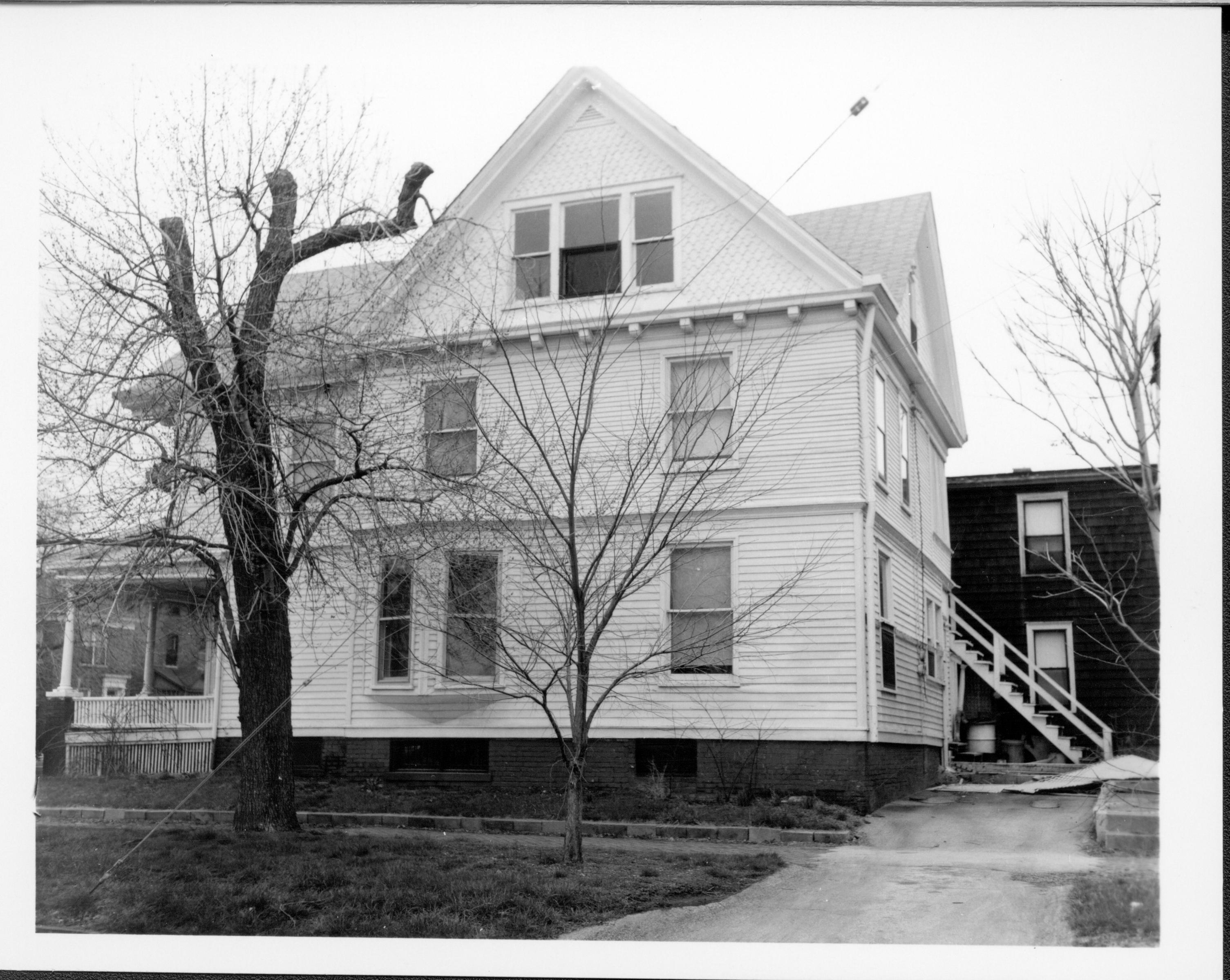 Home owned by William Hermes in use as apartments, South elevation along Jackson Street, Block 7, Lot 8.  House in background owned by Eleanor Pruett, Now the location of the Visitor Center 5 Hermes, Pruett, Jackson Street, Visitor Center