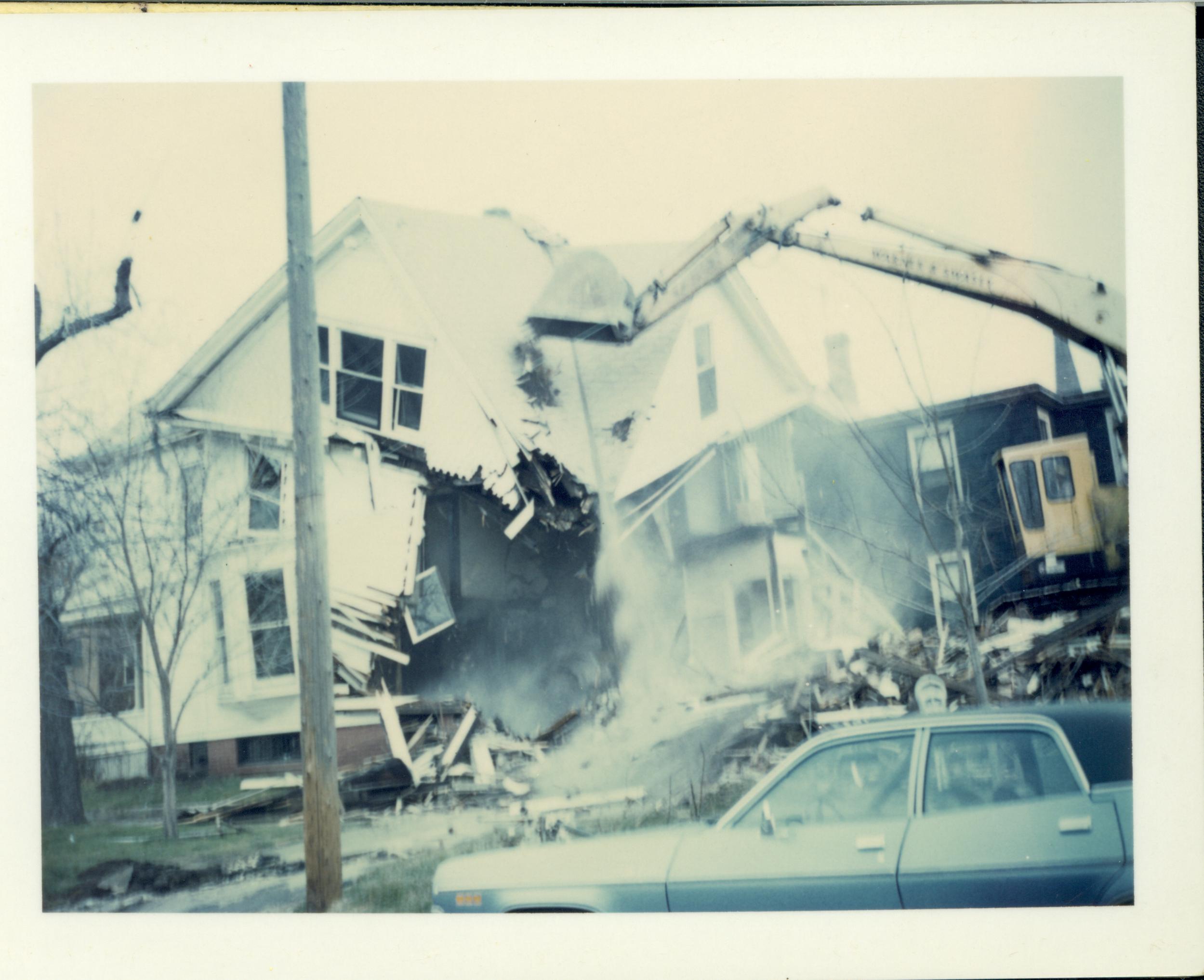 House owned by William Hermes in process of being razed, Block 7, Lot 8 along 7th Street.  House in background owned by Eleanor Pruett.  Area is now Visitor Center Looking North from Jackson Street Hermes, Pruett, Visitor Center, Jackson Street, razing