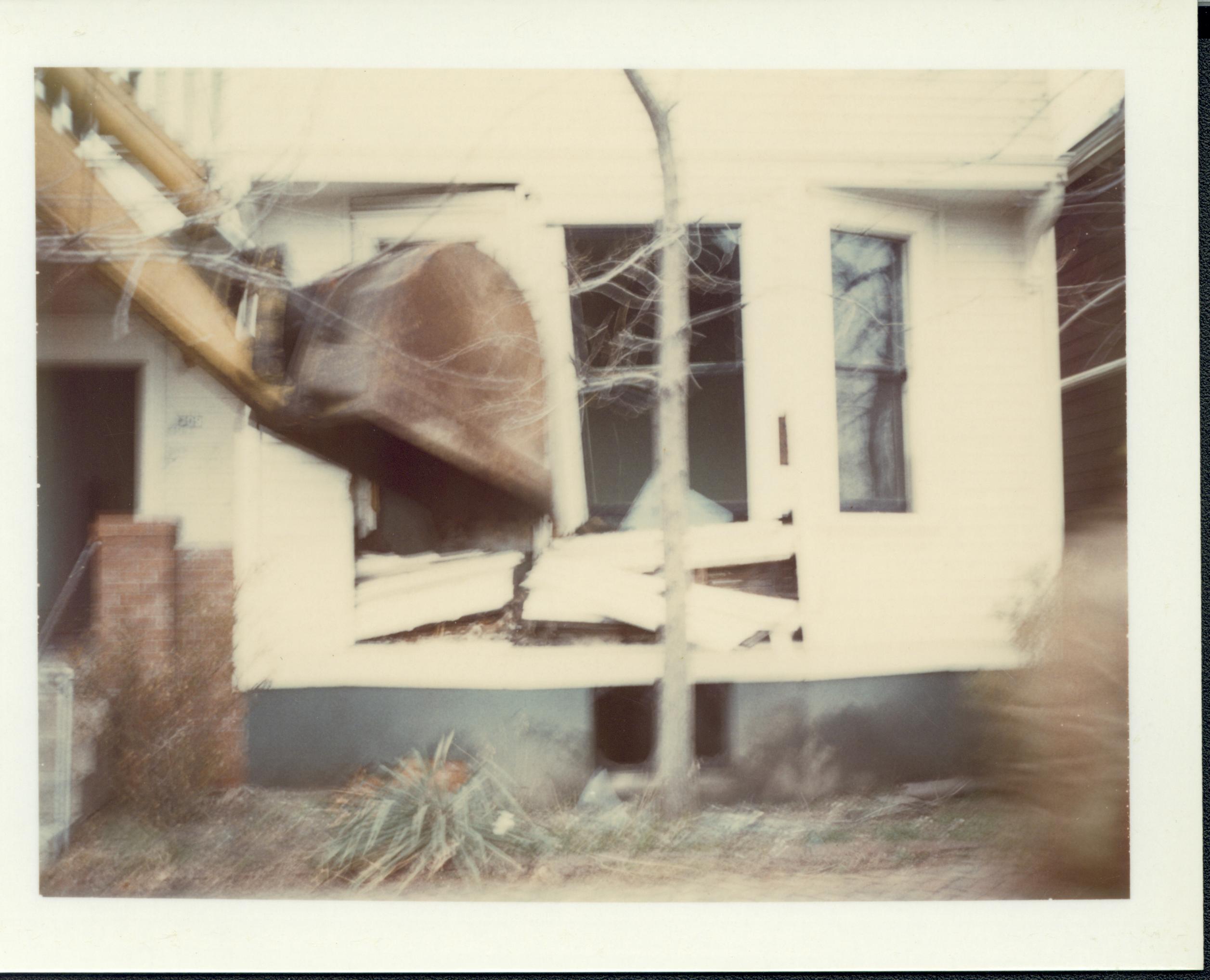 Duplex apartment owned by William Sheehan, Block 7, Lot 8, along Jackson Street, in the process of being razed.  Area is now Visitor Center. Blurry, looking North from Jackson Street Sheeham, Visitor Center, razing