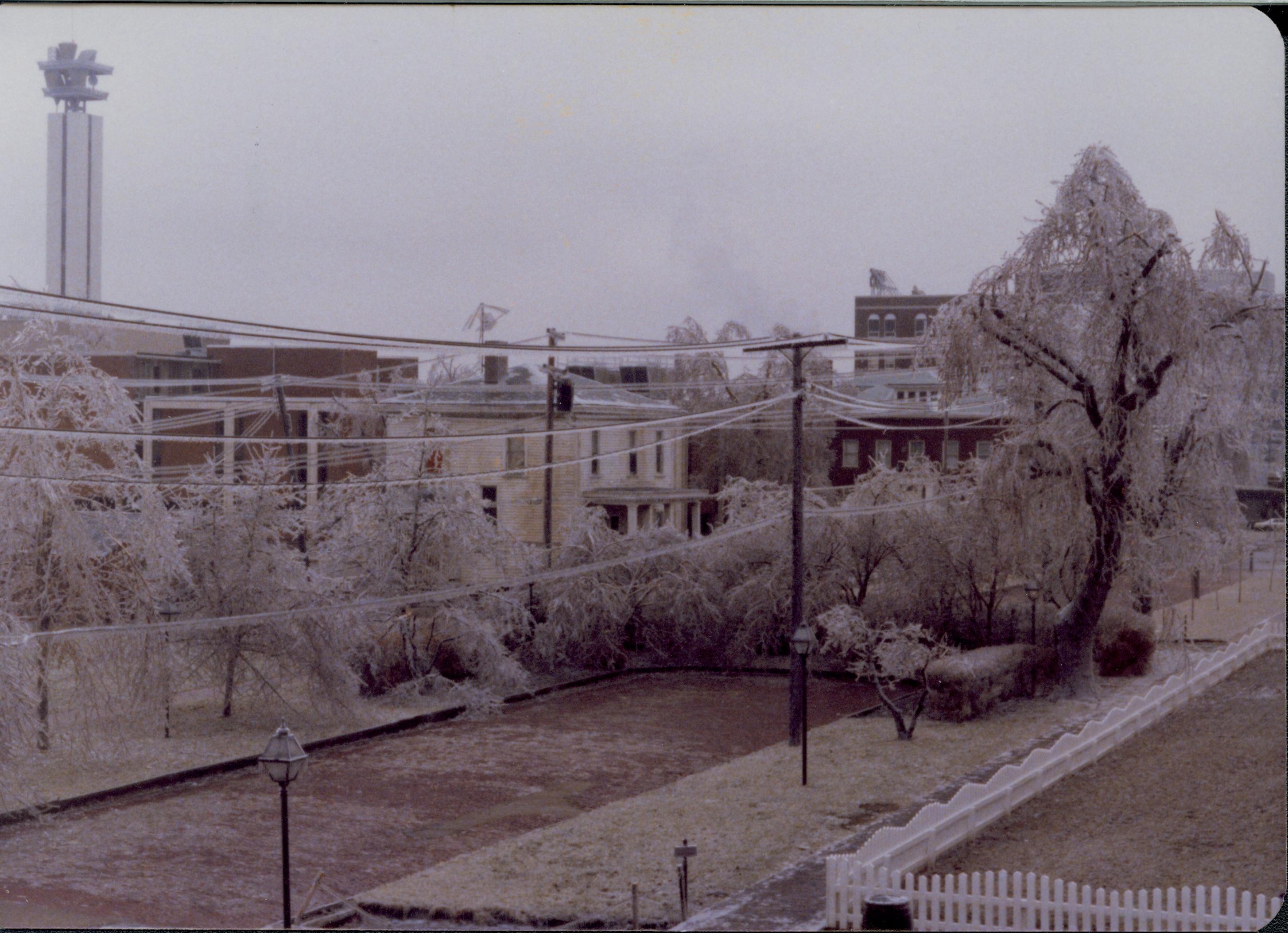 Ice Storm - Jackson Street, AT&T building in background left, yellow house no longer standing in what is now visitor parking lot Looking west Ice Storm, Jackson, AT&T