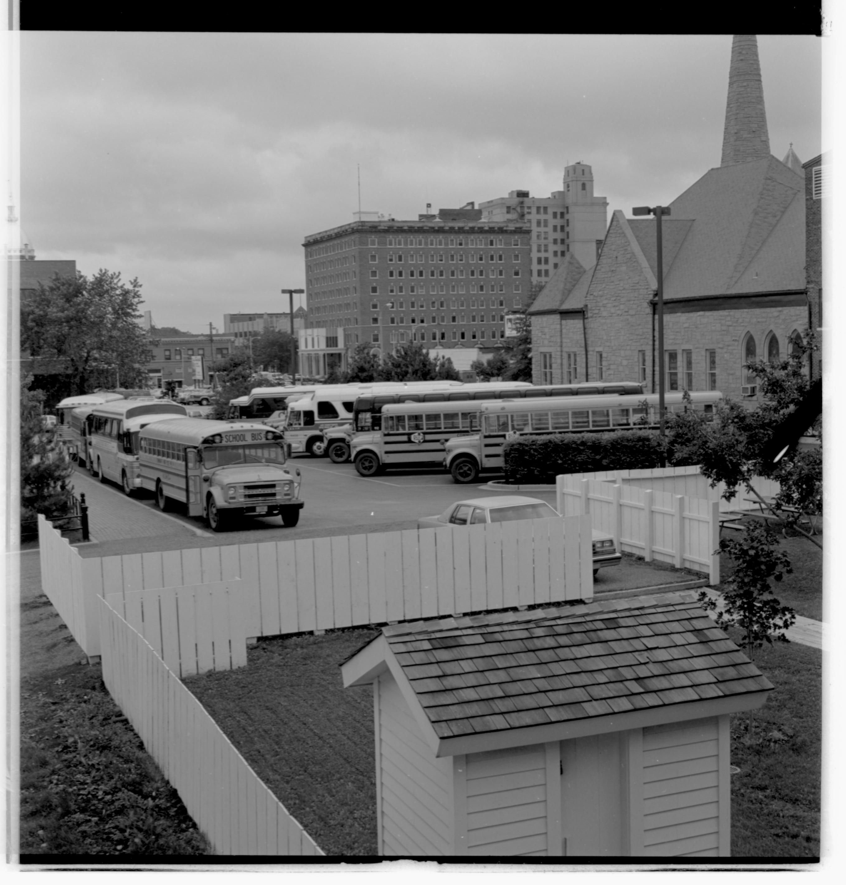 Parking lots - Bus lot, Grace Lutheran Church on right, Lyon Shed in foreground, former Leland Hotel in background looking Northwest buses, parking lot, Grace Lutheran Church
