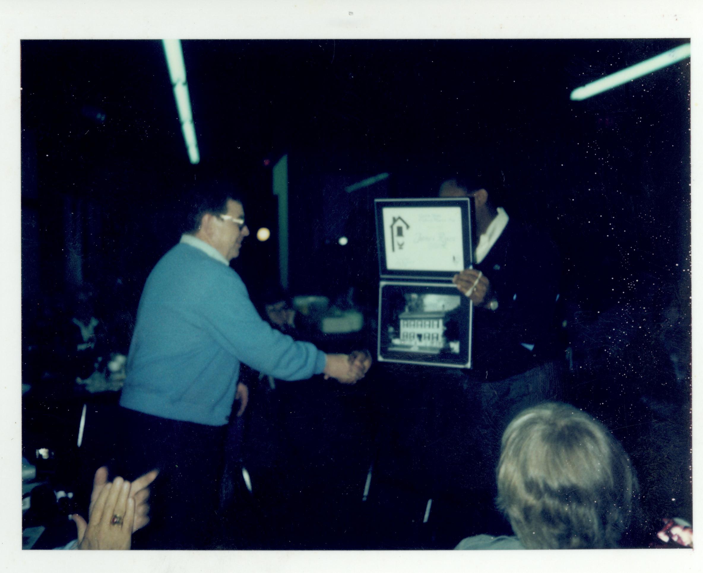 Award ceremony for staff in Conference Center in the fall of 1988. Supt. Gentry Davis giving award to ? looking East on second floor awards, staff, Conference Center