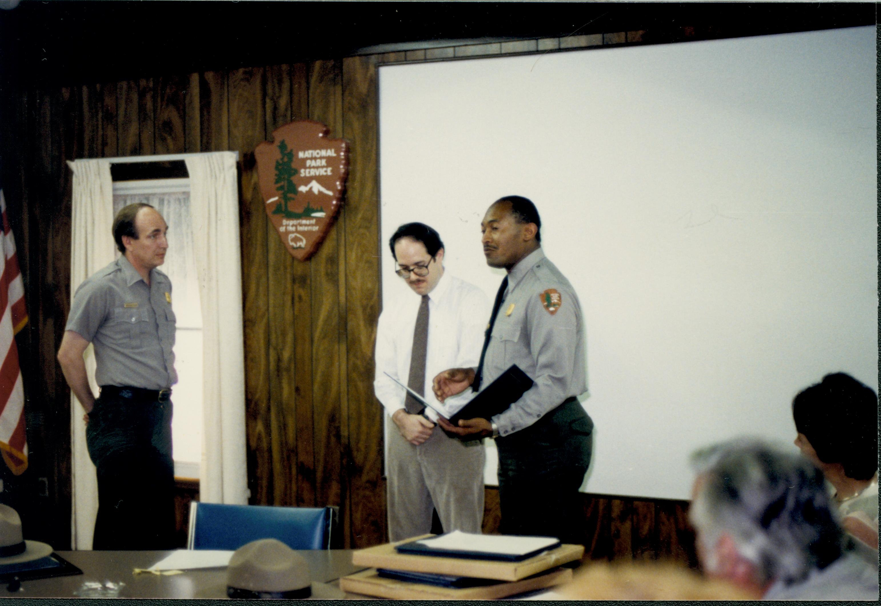 Site Supt. Gentry Davis giving out special achievement awardt to ? in Conference Center. Looking West on second floor awards, staff, Conference Center