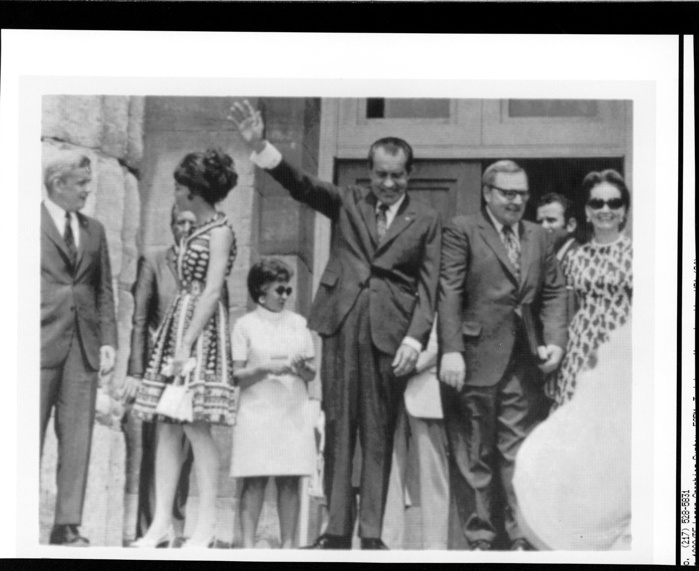 President Nixon waves to crowd as he emerges from Old State Capitol after signing Lincoln Home legislation. 