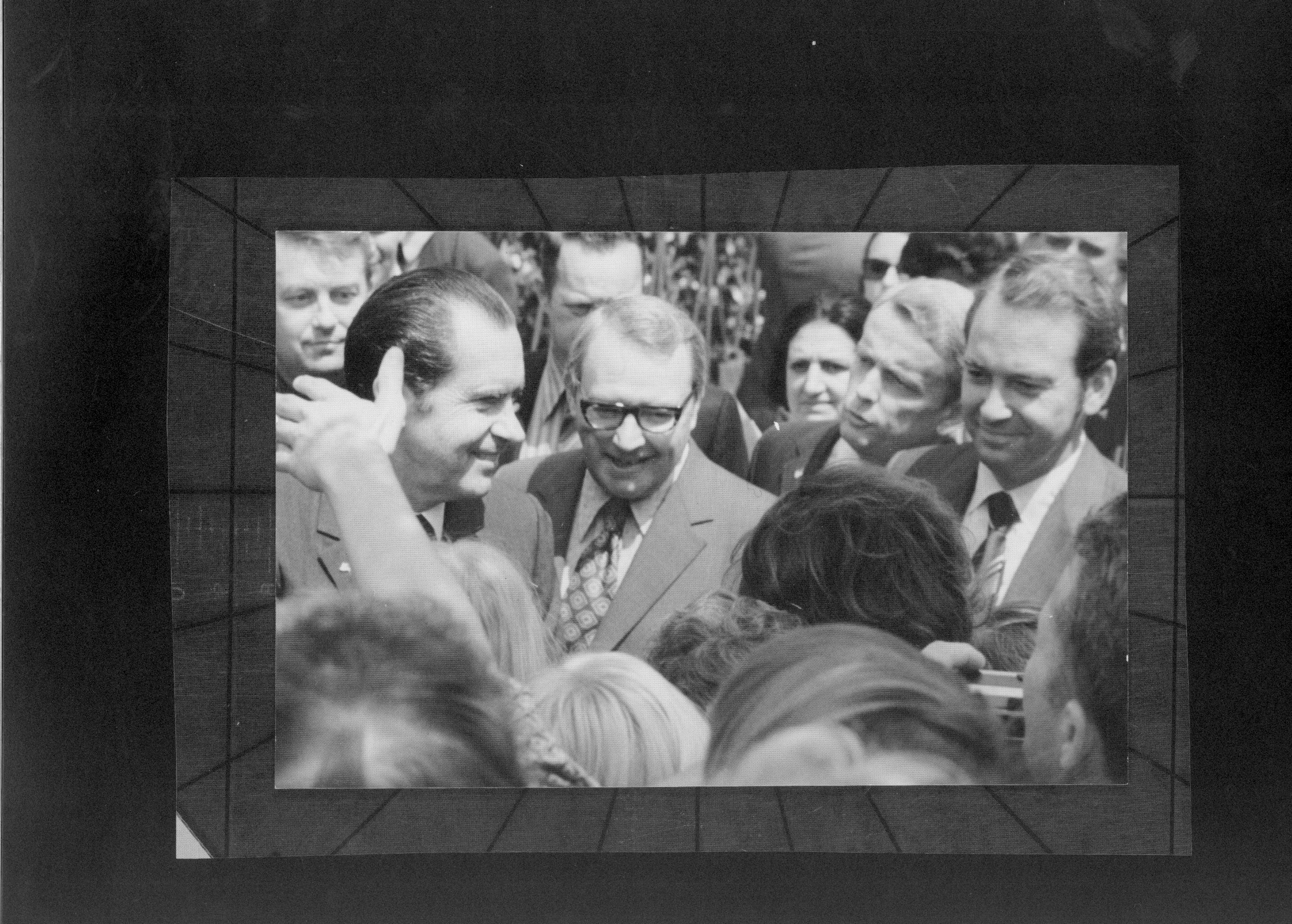 20th District Congressman, Paul Findley introduces some of the people to the President outside the Old State Capitol. White House correspondent Helen Thomas can be seen behind Gov. Ogilivie and Congressman Findley 