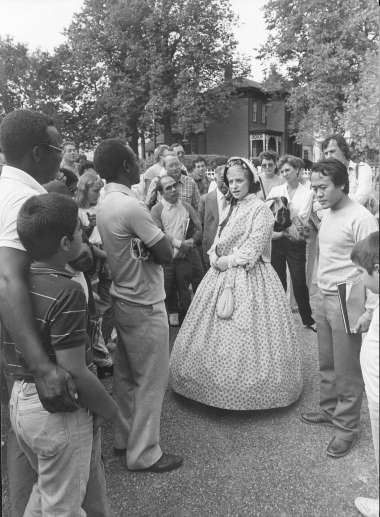 Judy Winkelman as Ellie Chatterton Interpreter Judith Winkelmann is shown talking to visitors at LIHO NHS. Interpretation, Costumes