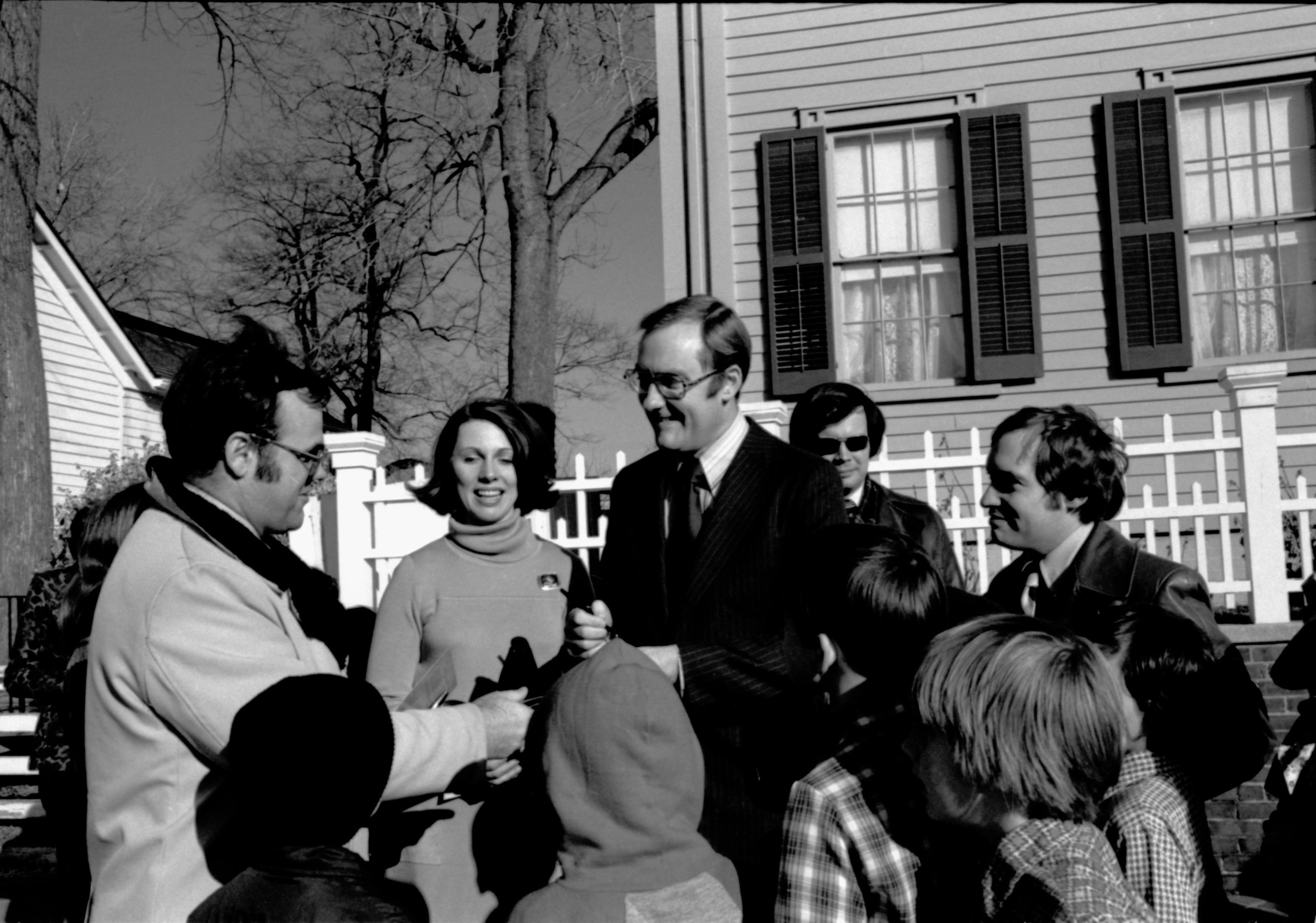 Autograph seekers crowd around Illinois Gov. James R. Thompson and his wife Jayne. An hour earlier the governor delivered a n address dedicating the new visitor center an hour before.  Lincoln Home NHS- Visitor Center Dedication Ceremony Lincoln Home, ceremony, dedication