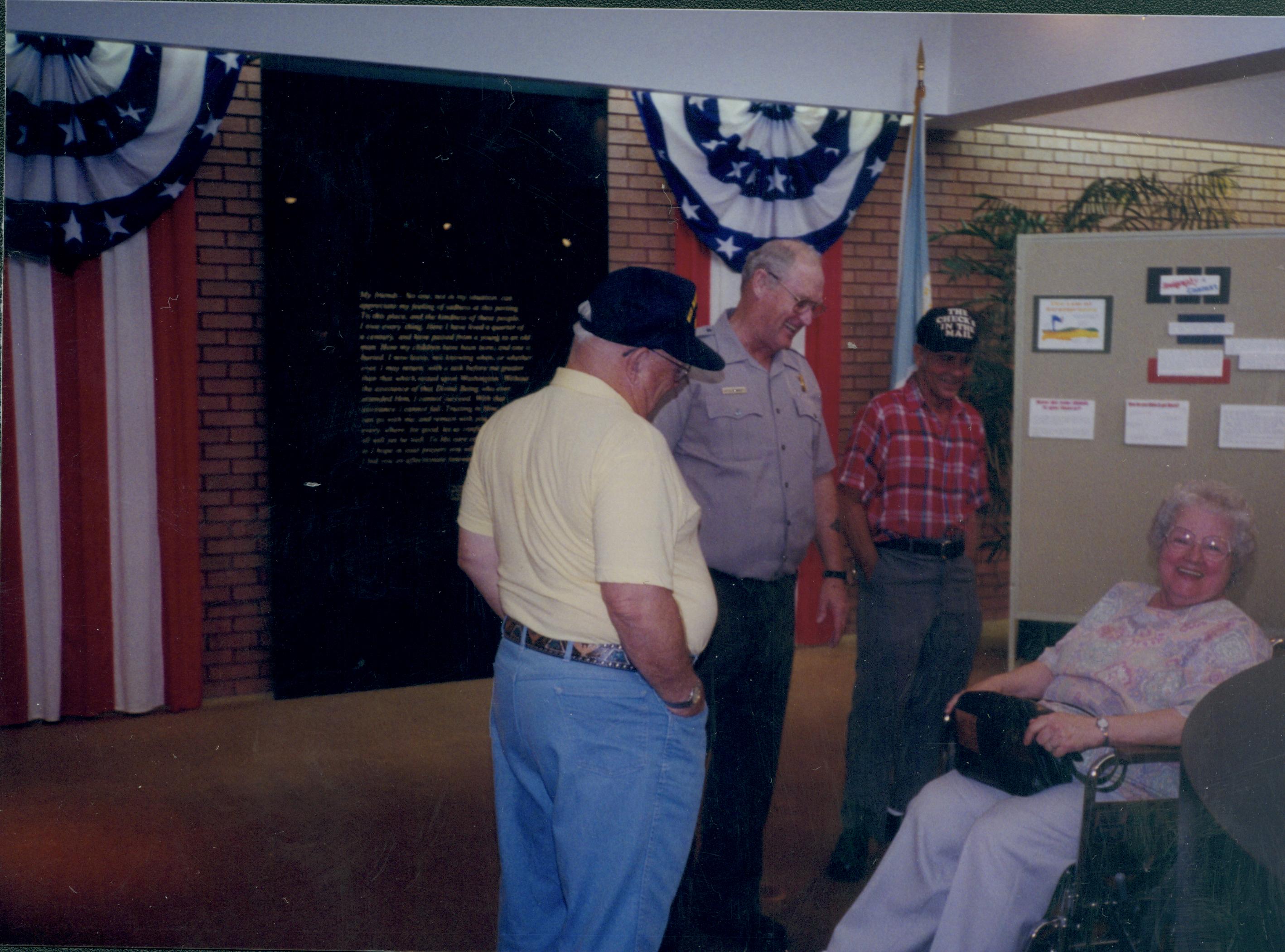 Coy Crimmit assists visitors, one in wheel chair Lincoln Home NHS- Visitor Center, Roll 15 exp 10, 15-10 Visitor Center, entrance