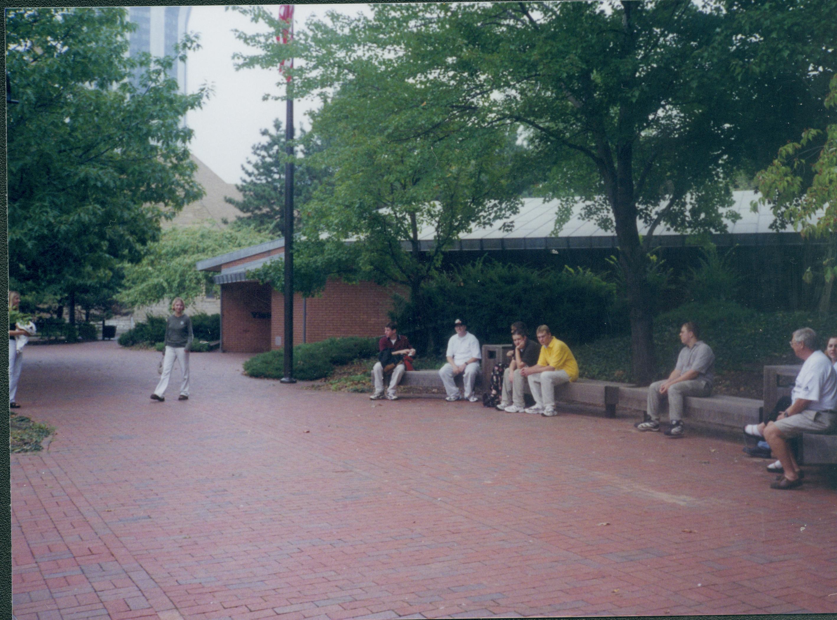 Students sitting on benches near corner of 7th and Jackson Streets Lincoln Home NHS- Visitor Center, Roll 15 exp 16, 15-16 Visitor Center, benches
