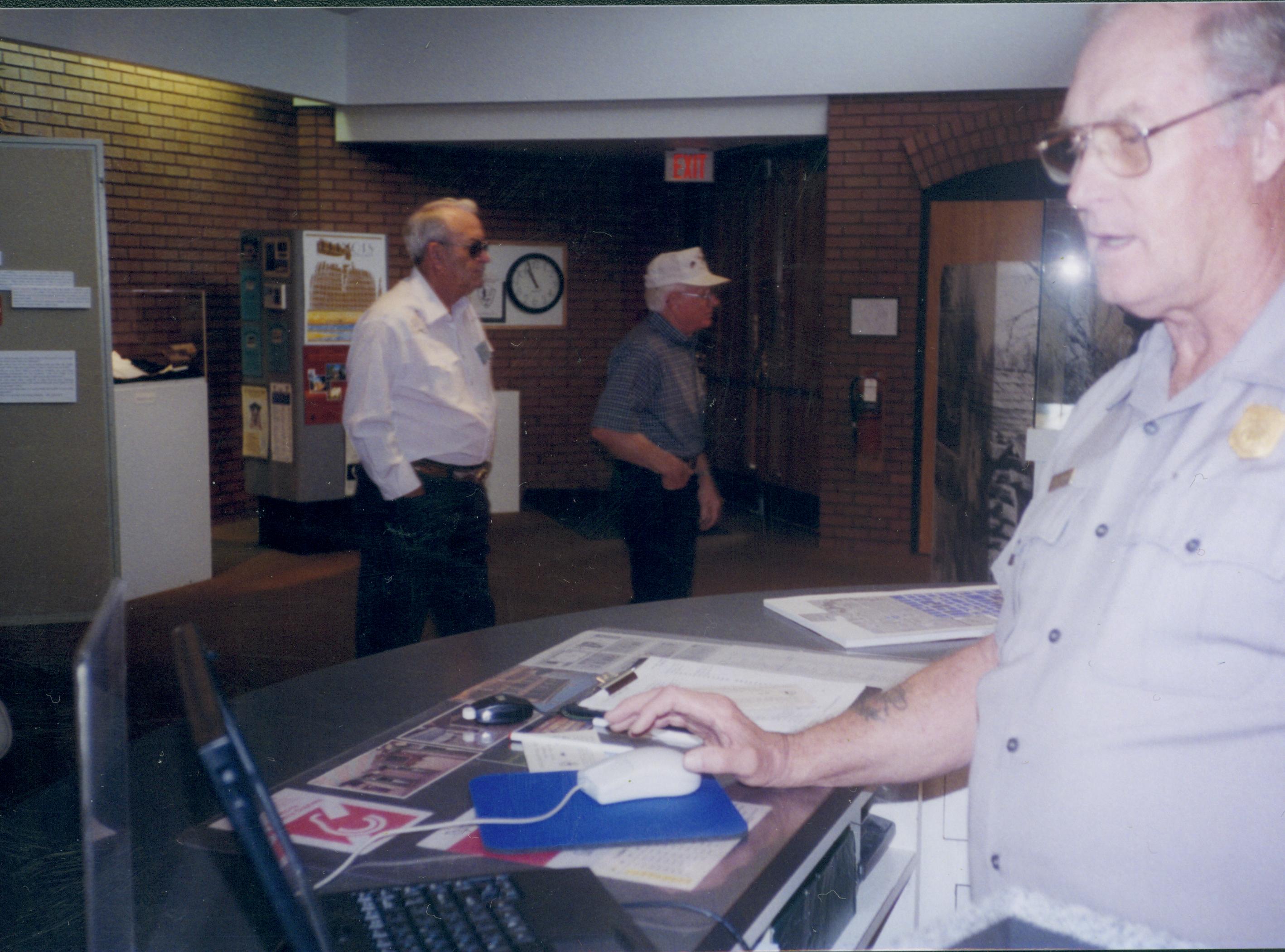 Coy Grimmit uses first computerized ticket distribution system Lincoln Home NHS- Visitor Center, Roll 15 exp 22, 15-22 Visitor Center, tickets