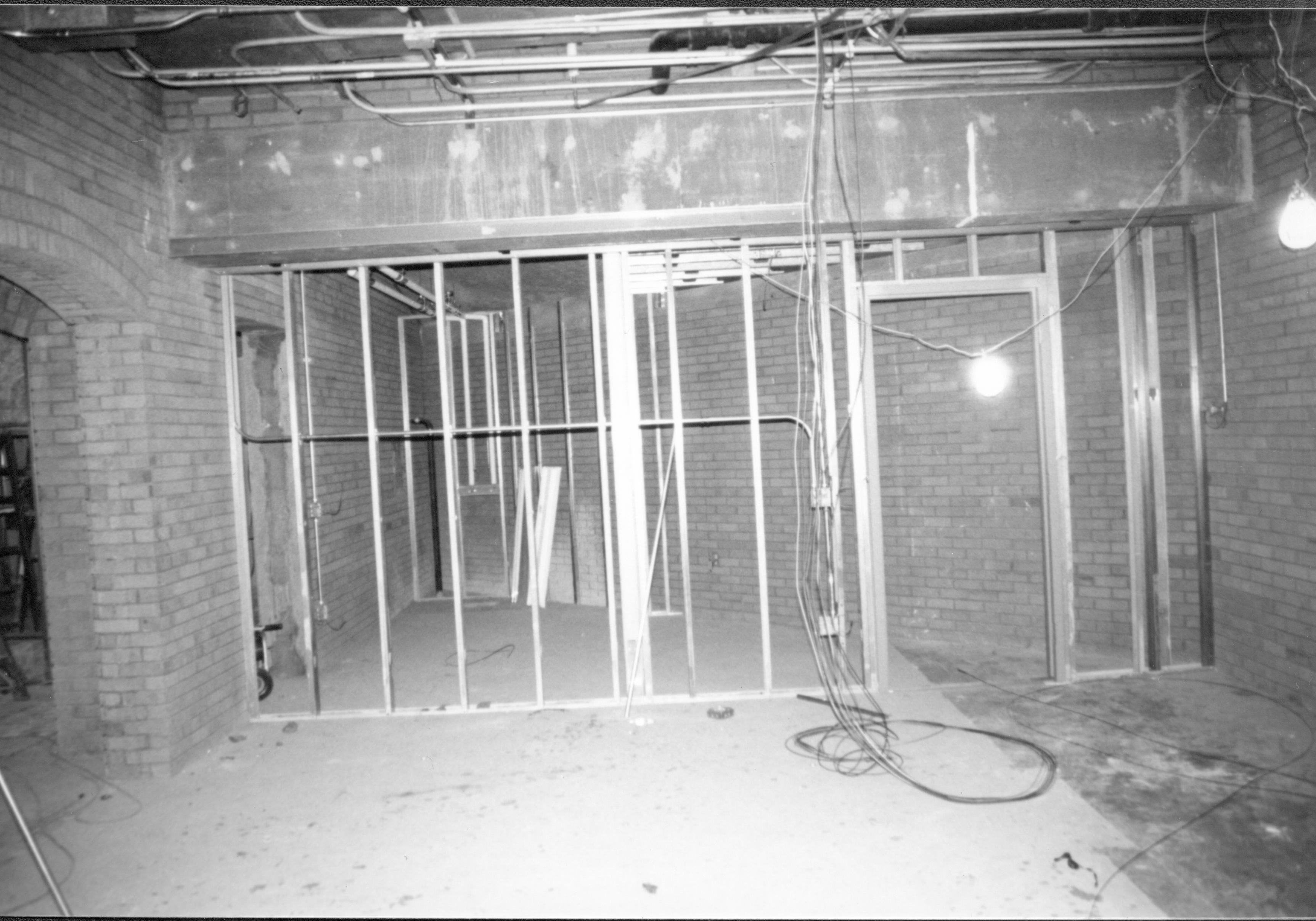 Visitor Center - remodeling, bookstore area and framing for storeís storage.  Restroom archway on left. Looking Northwest from bookstore area. Visitor Center, remodeling, bookstore, storage, restroom