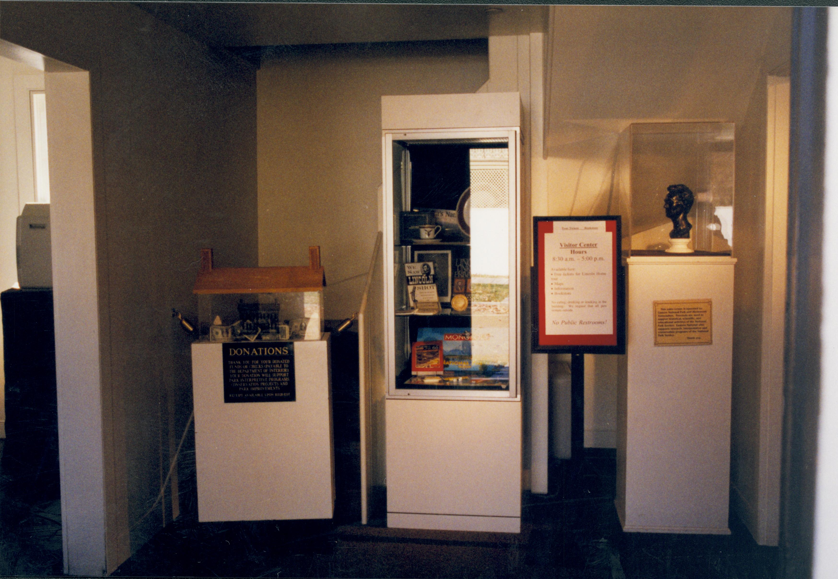 Front hall set up with cases, donation box and signs Lincoln Home NHS- Visitor Center remodel,  Roll 1999-15 exp 21 Visitor Center, Arnold, temporary