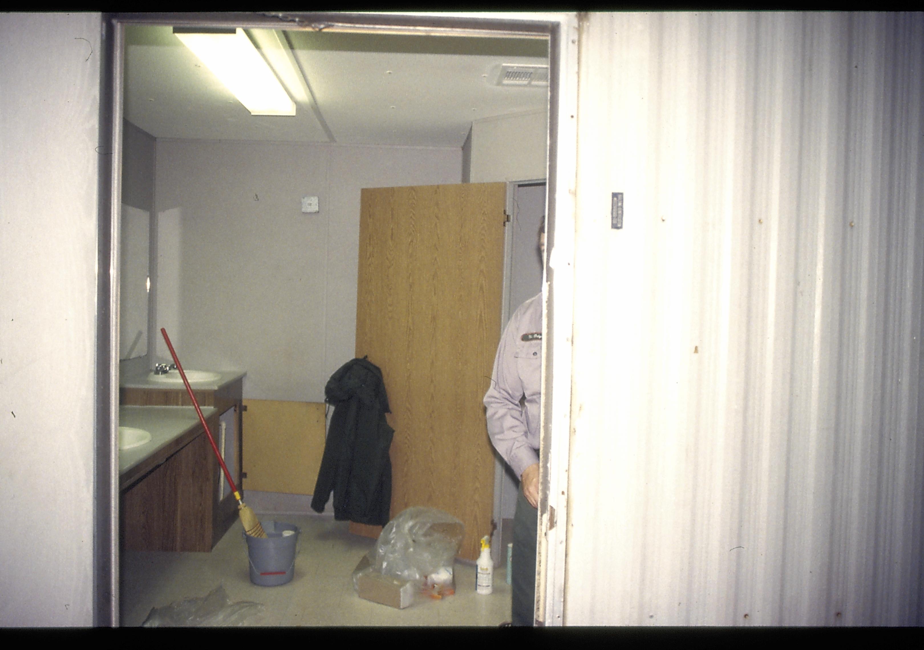 Mens restroom being cleaned Lincoln Home NHS- Visitor Center remodel,  Roll 1999-11 exp 8 Visitor Center, Corneau, restroom, temporary