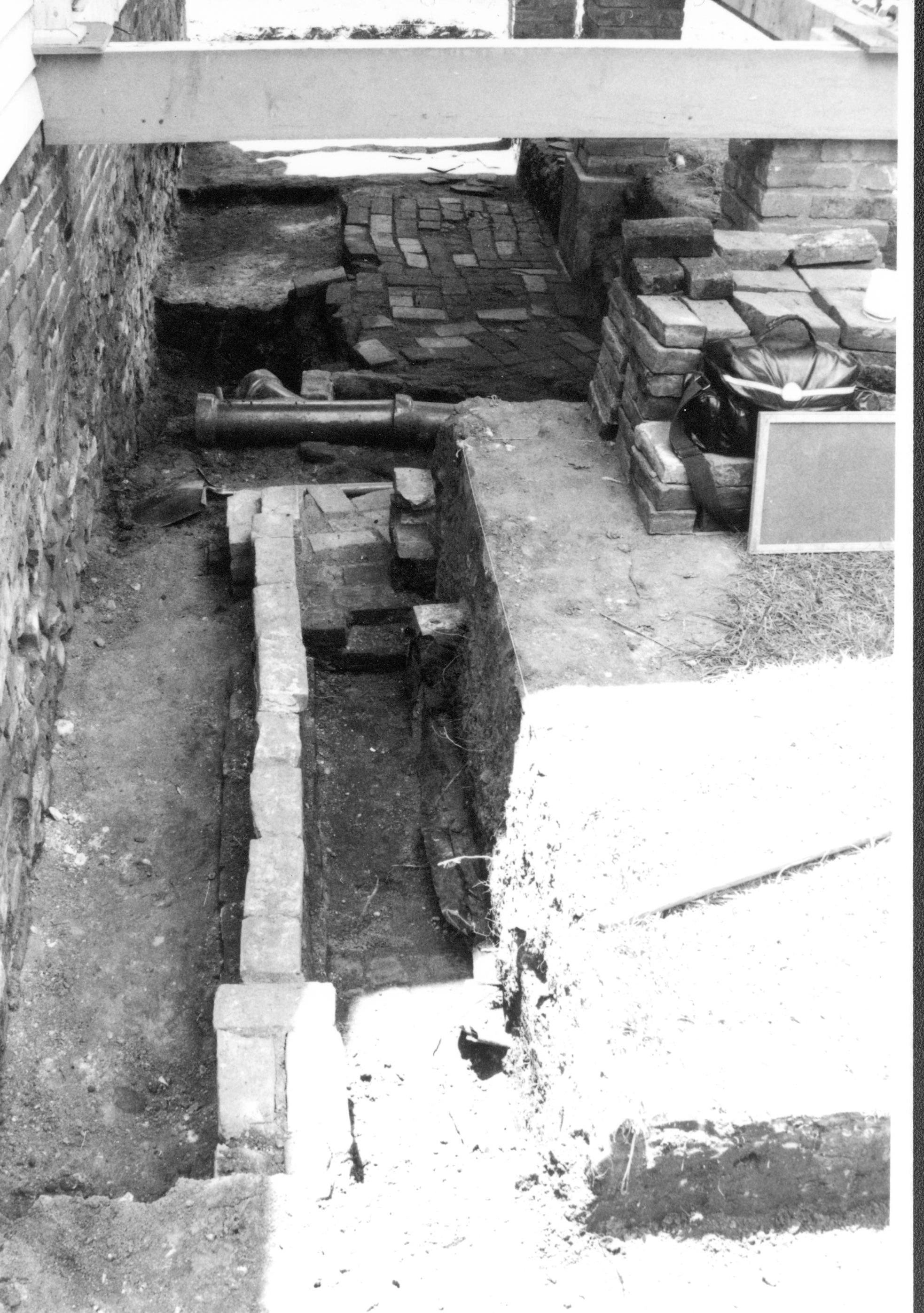 Archeological excavation- beneath rear porch, north Lincoln Home NHS- Sprigg House HS-11, foundation and fence, Roll #4 exp 5 Sprigg House, foundation