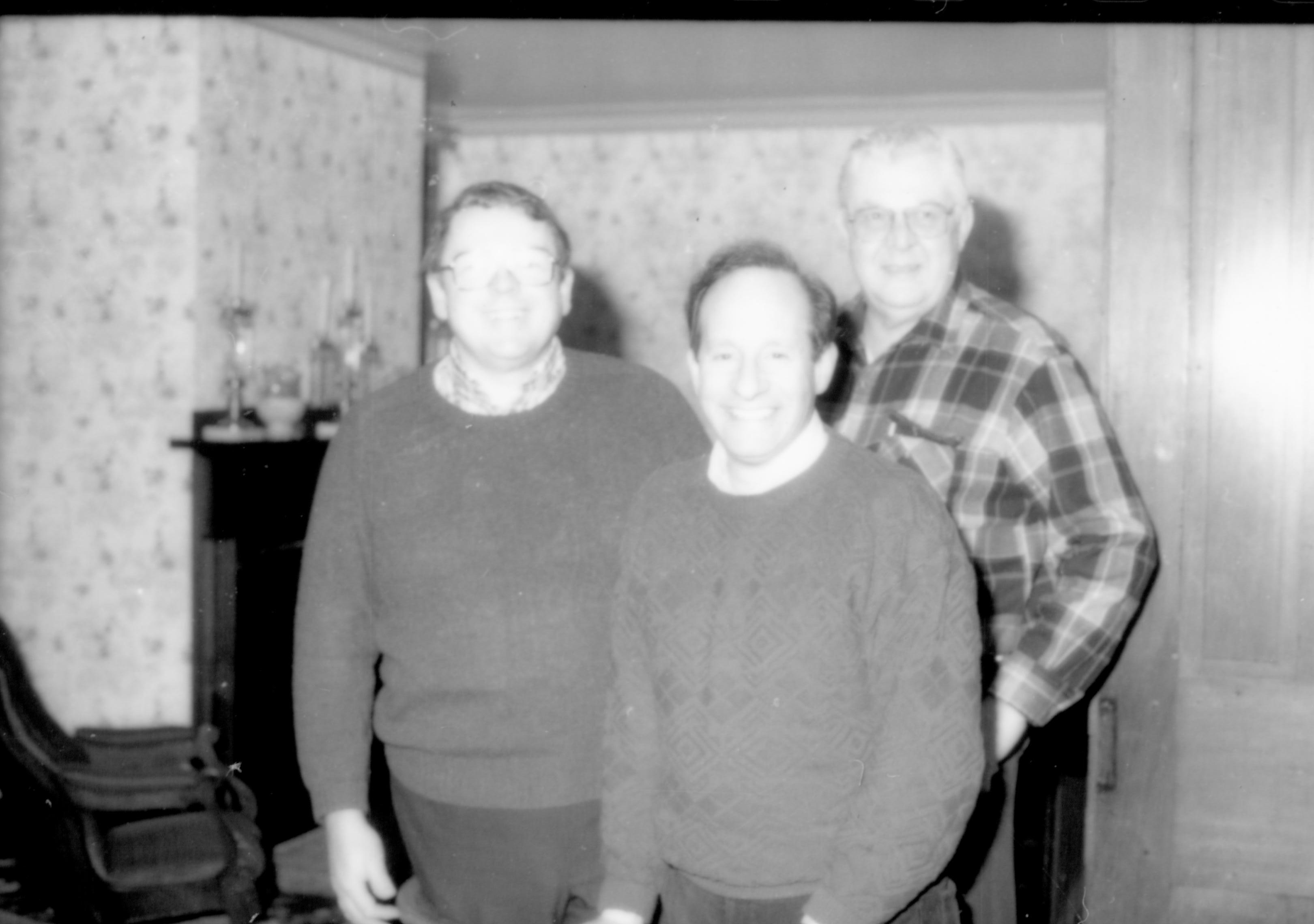 Three men (production crew) in rear parlor. Lincoln Home NHS- Lincoln's Birthday, 76434 birthday, tour