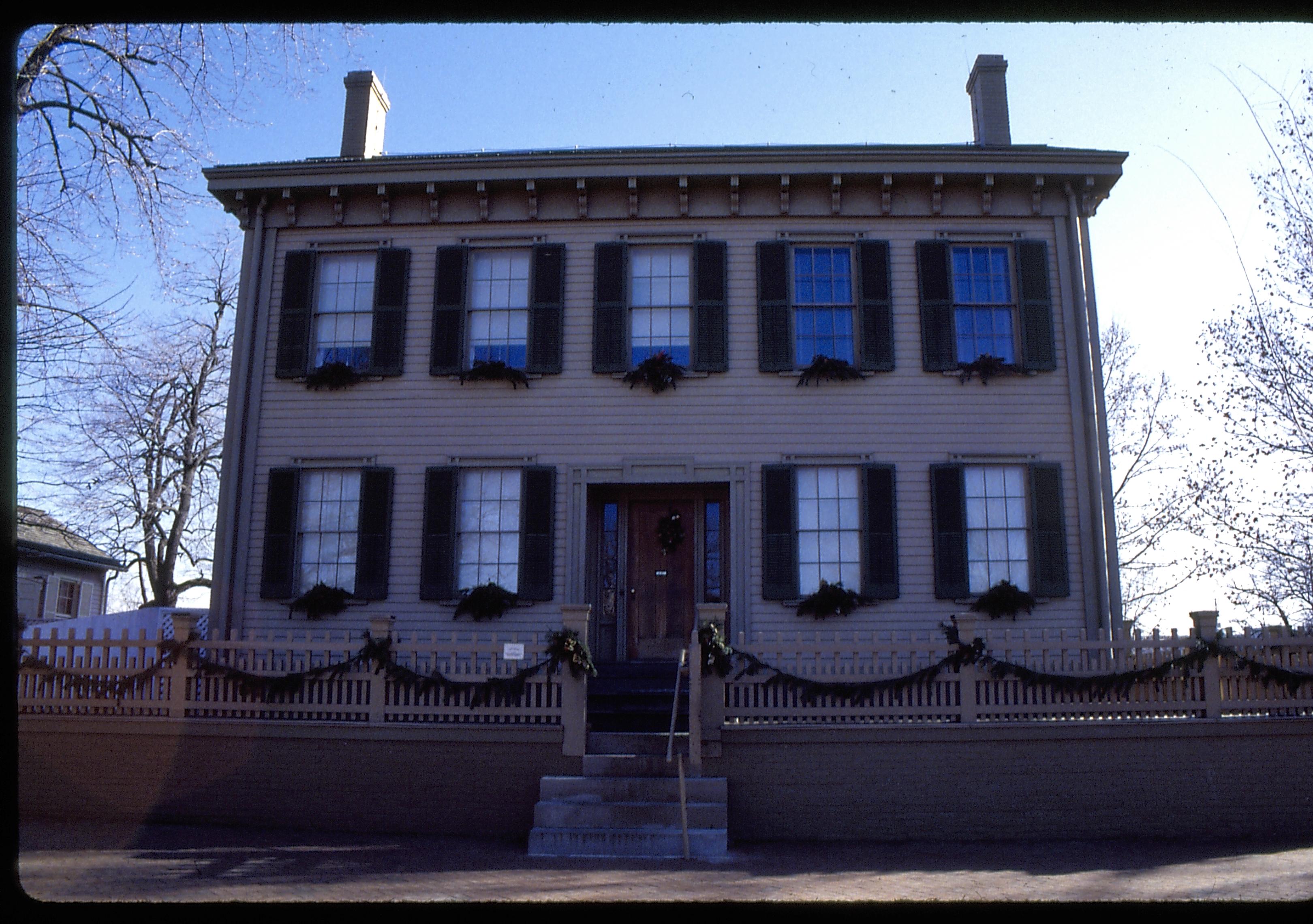 Exterior front of Lincoln home with Christmas decorations. Lincoln Home NHS- Christmas in Lincoln Home 1997, HS-20 Film Roll #17 Christmas, decorations