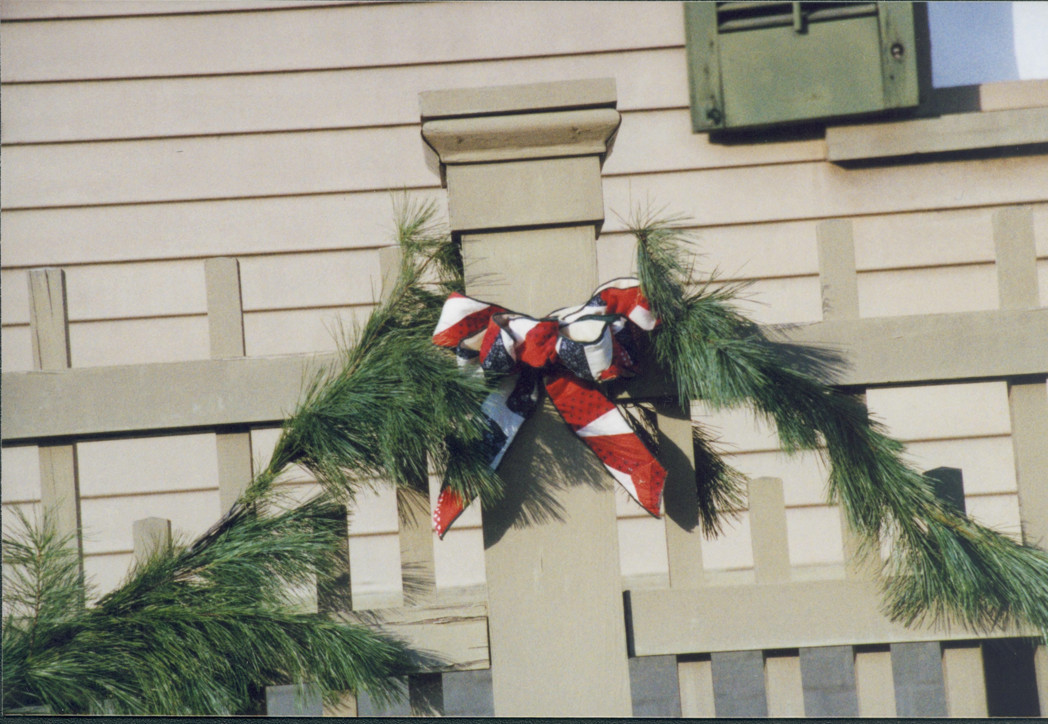 Christmas decorations on front fence post. Lincoln Home NHS- Christmas in Lincoln Neighborhood 2000, HS-01 2000-10 Christmas, decorations, neighborhood