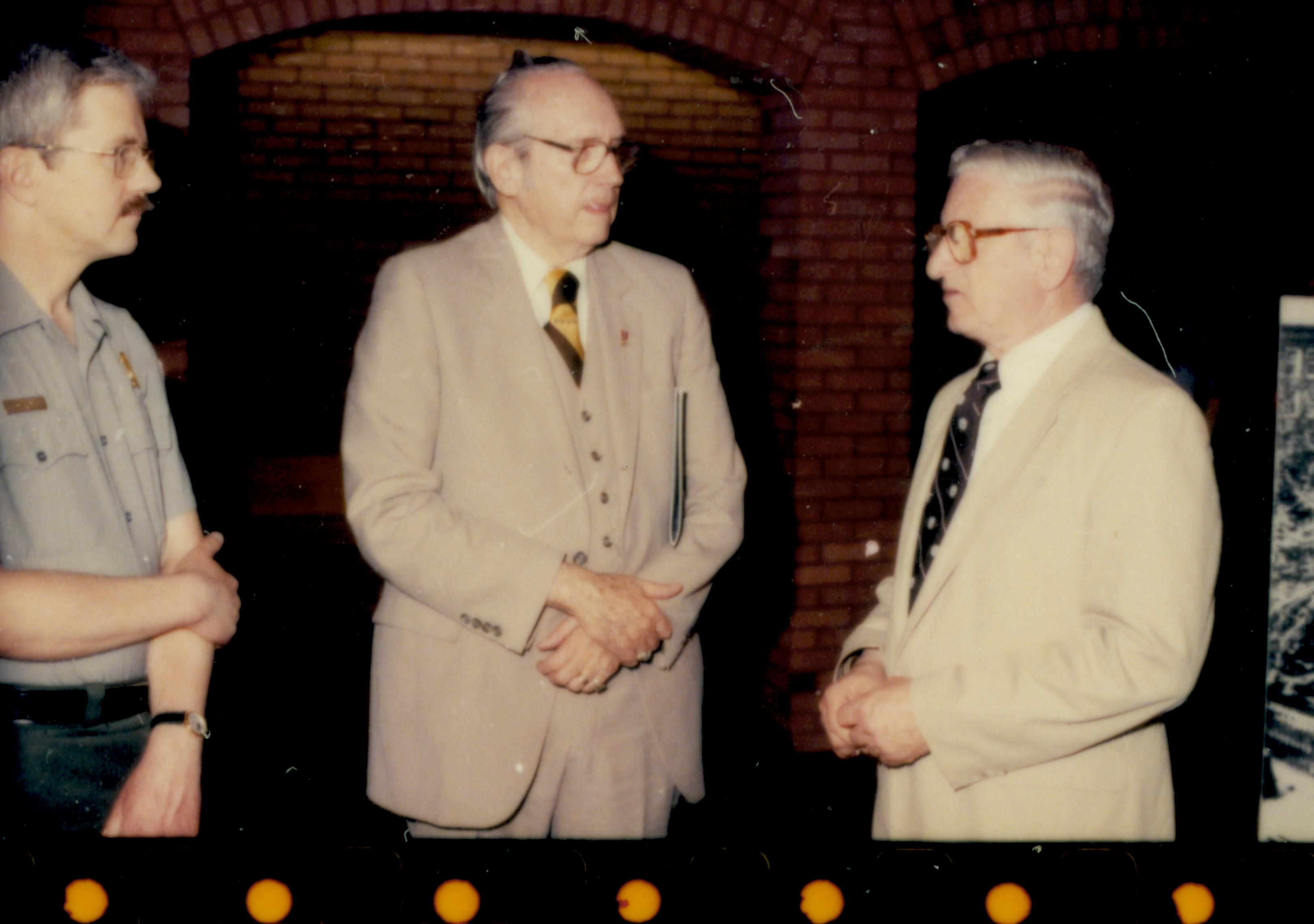 Admiral Richard Ford visiting Springfield for Commissioning of Submarine Springfield.  Admiral Ford visiting with park Historian George Painter and Springfield Mayor Ossie Langfelder Looking north from Visitor Center main lobby  submarine, commissioning, Visitor Center, staff, reception