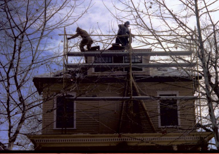 Men working on scaffolding at Cook house. Lincoln Home NHS restoration; Cook house.