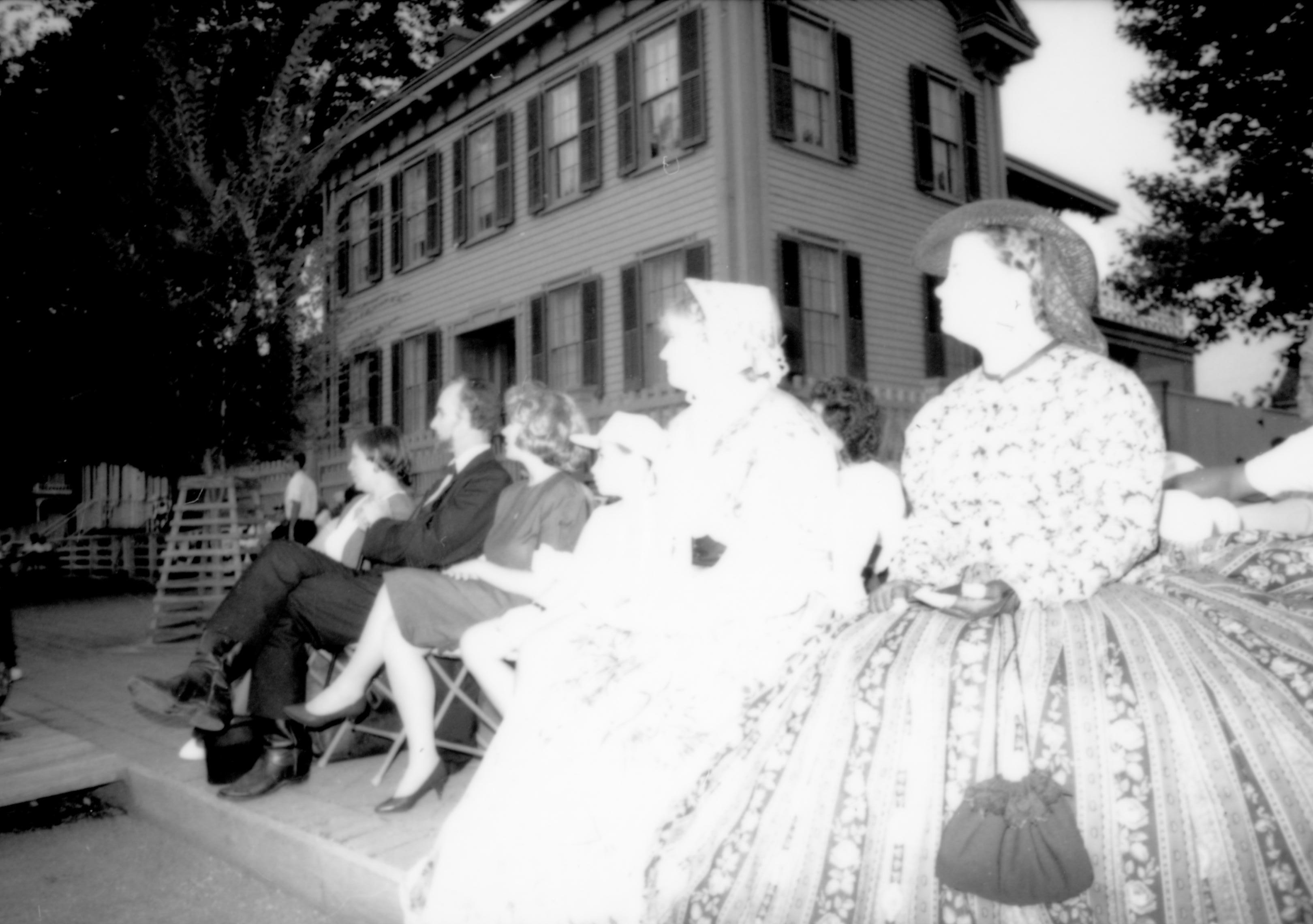 Two ladies in period dress listening to concert. Lincoln Home NHS- Coast Guard Band Concert, 87020 concert, Coast Guard