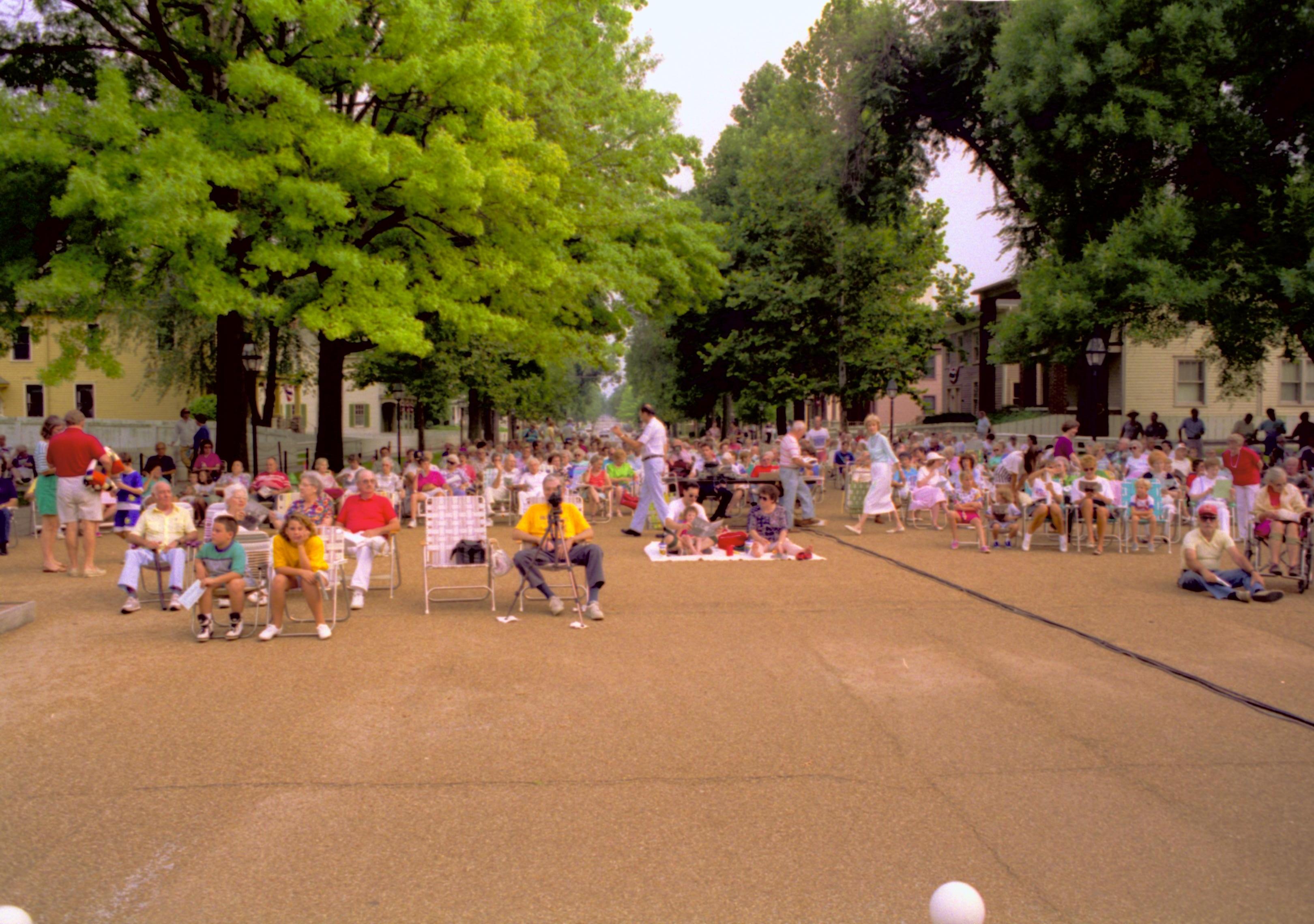 Public sitting on 8th street listening to Coast Guard band. Lincoln Home NHS- Coast Guard Band Concert, 267618 concert, Coast Guard