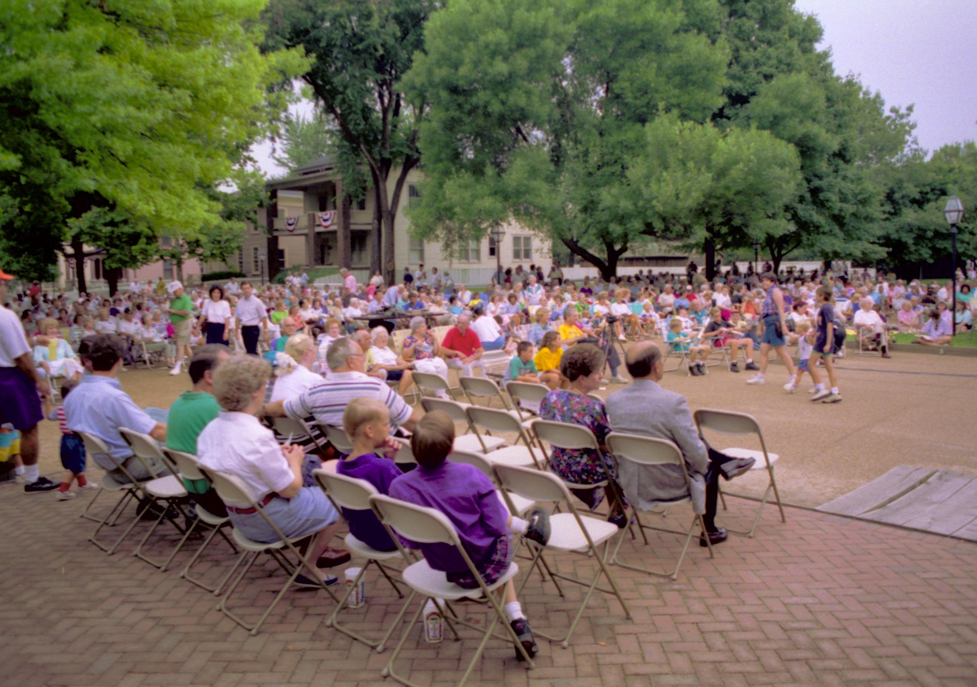 Public seated listening to Coast Guard band. Lincoln Home NHS- Coast Guard Band Concert, 267618 concert, Coast Guard