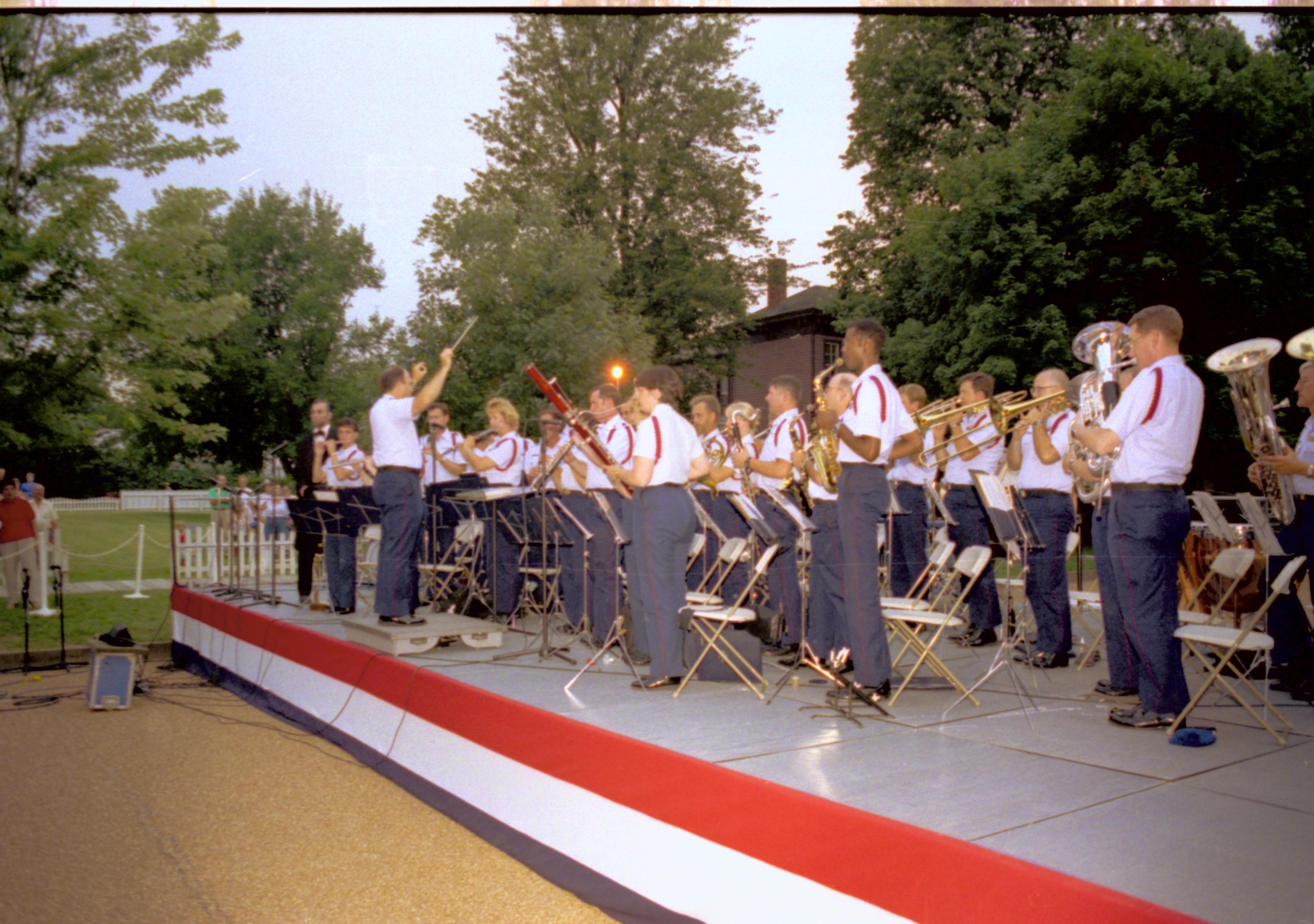 Coast Guard band on stage (standing). Lincoln Home NHS- Coast Guard Band Concert concert, Coast Guard