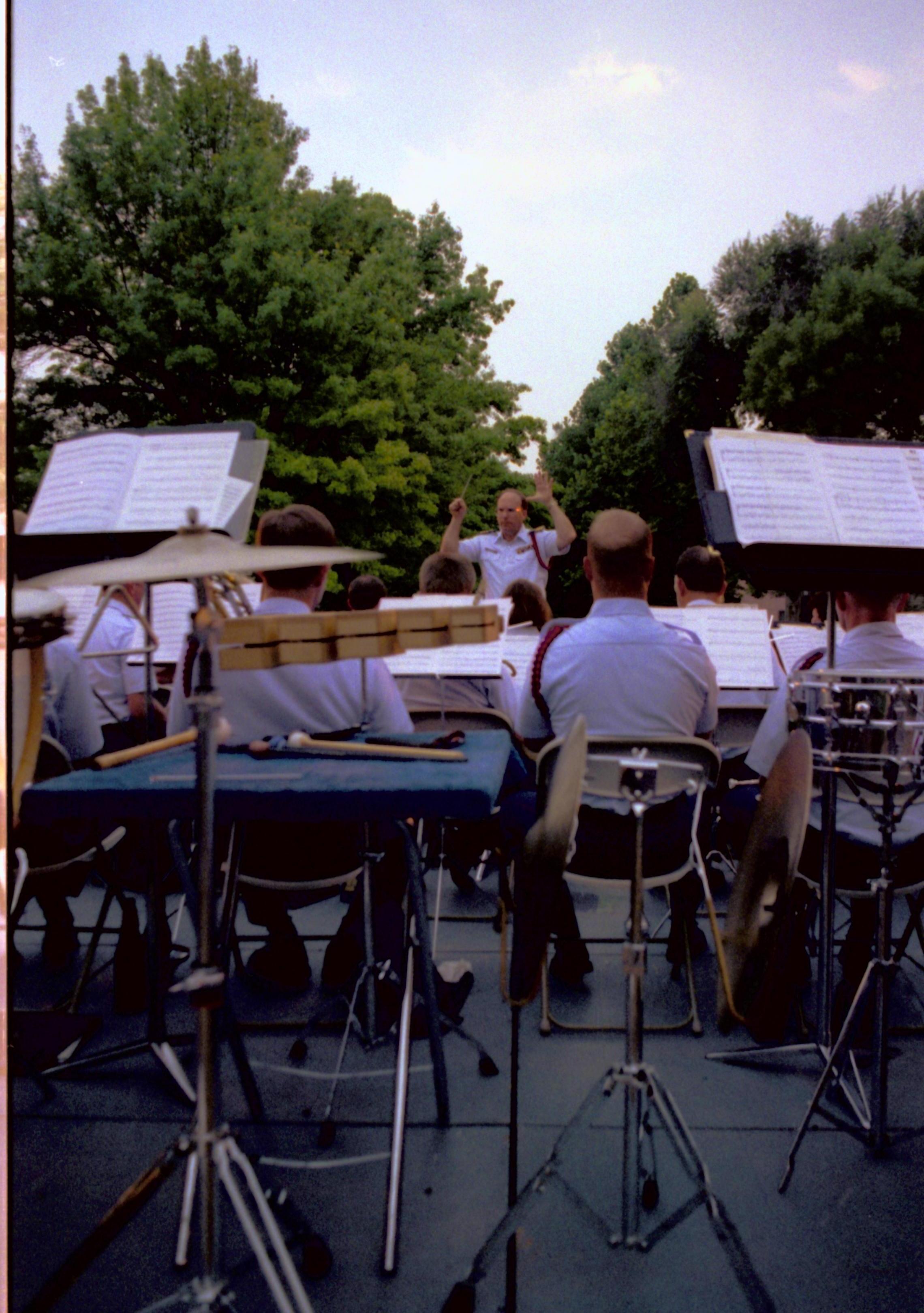 Coast Guard band on stage with director . Lincoln Home NHS- Coast Guard Band Concert concert, Coast Guard