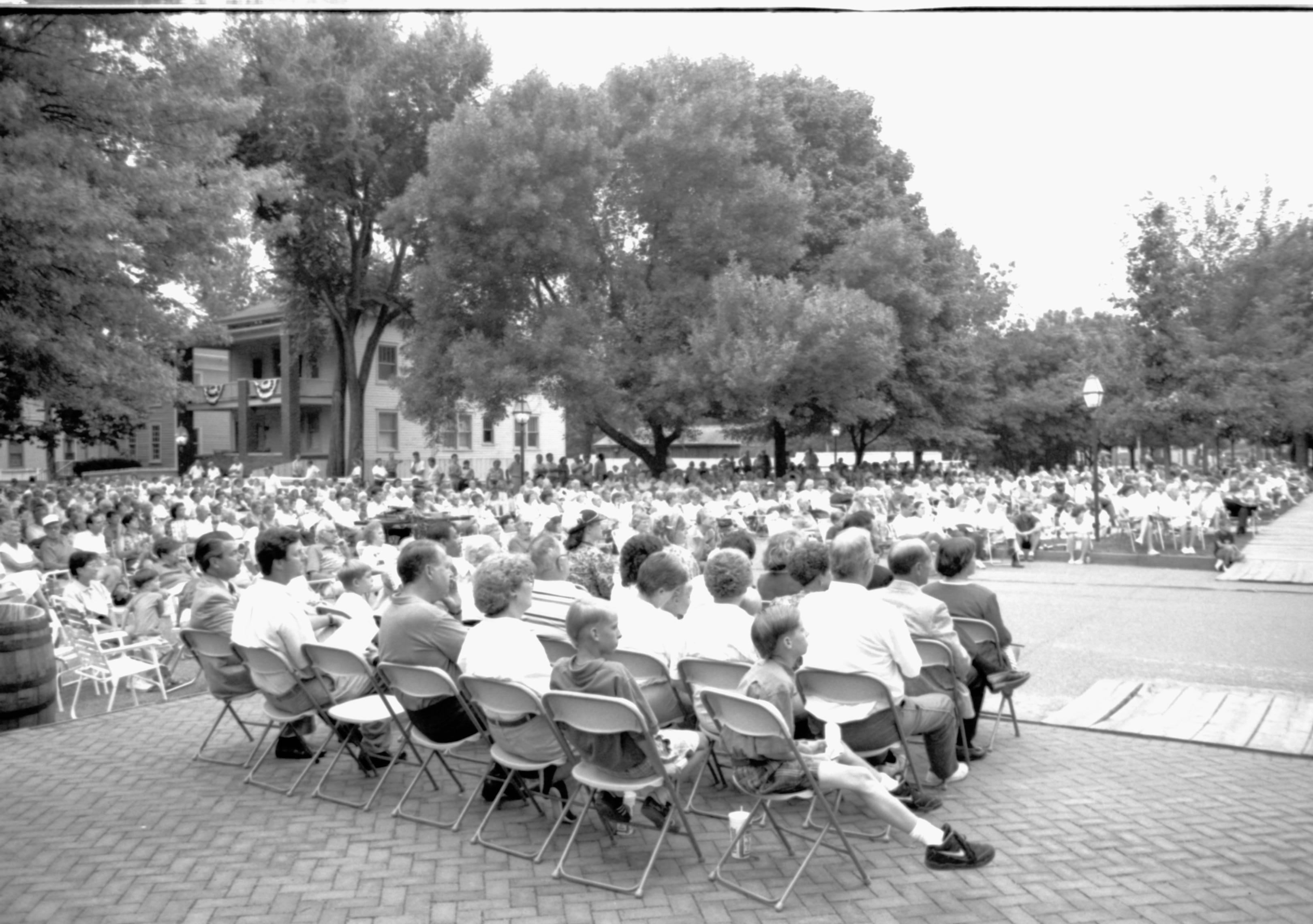 People sitting listening to concert. Lincoln Home NHS- Coast Guard Band Concert concert, Coast Guard