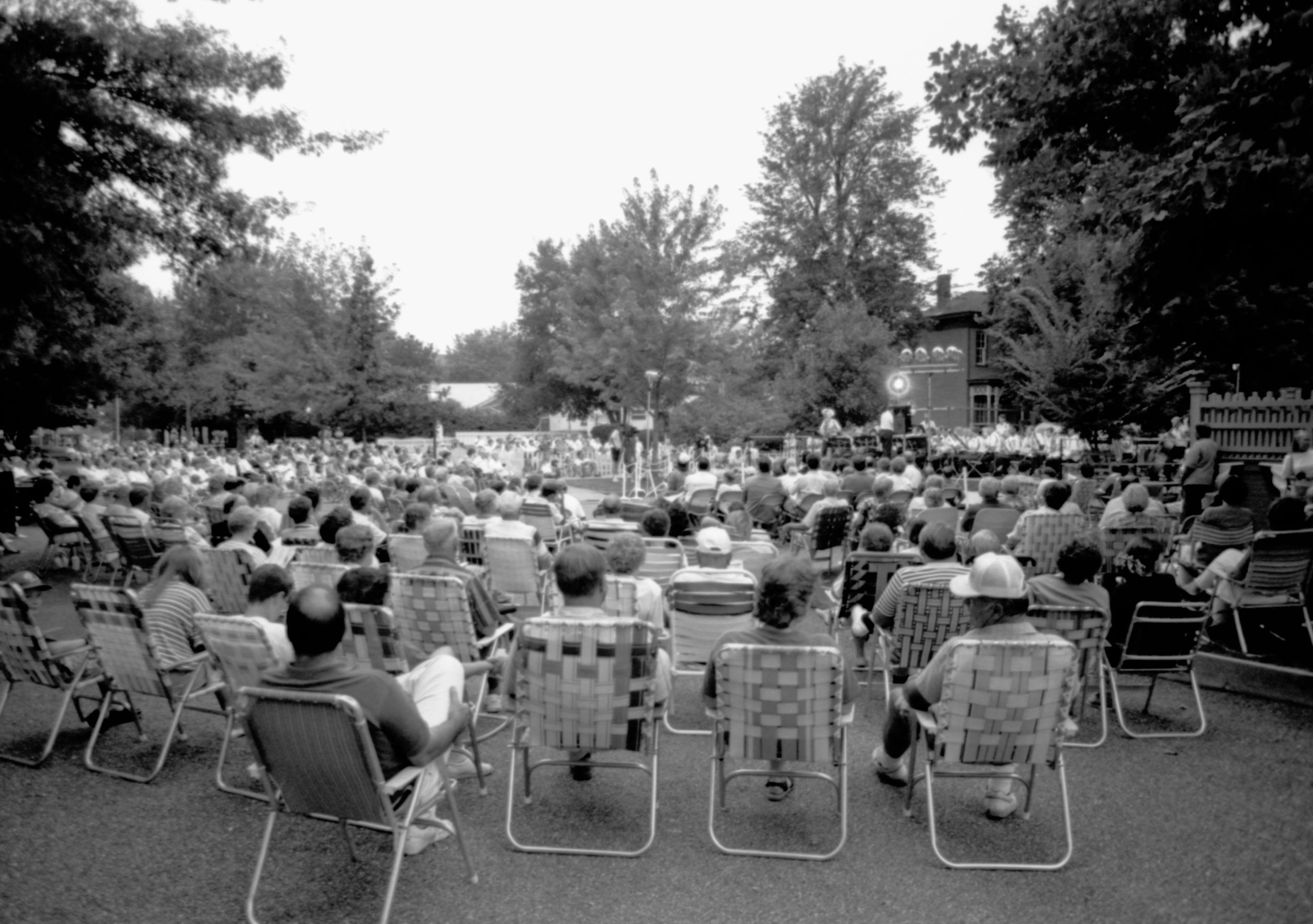 People sitting listening to concert. Lincoln Home NHS- Coast Guard Band Concert concert, Coast Guard