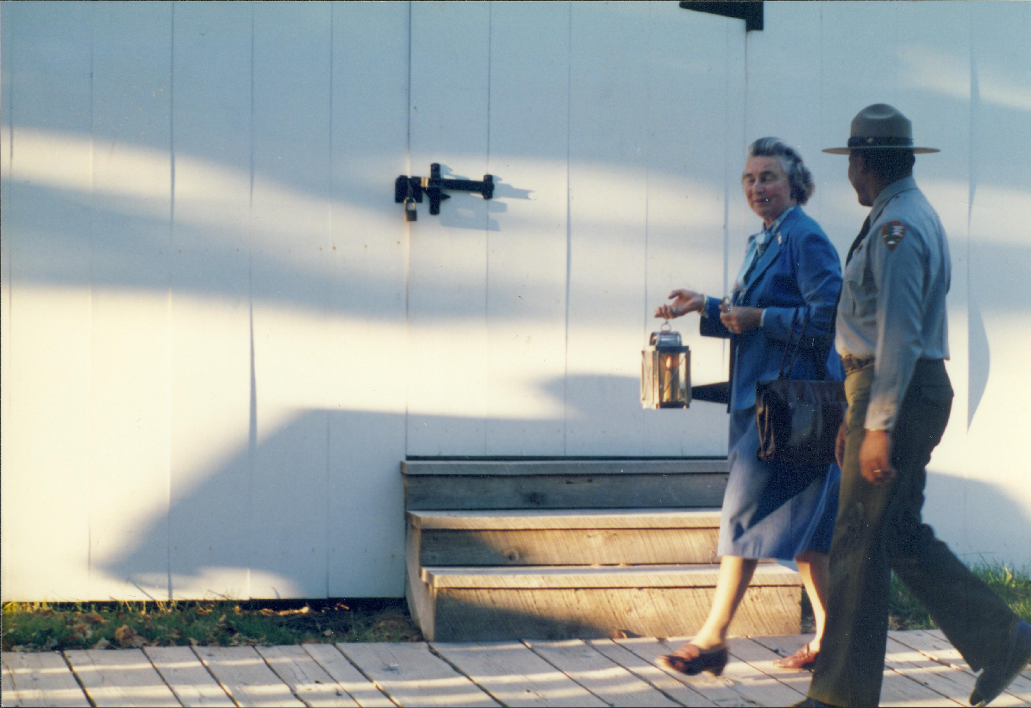 Ranger walking with lady carrying lantern. Lincoln Home NHS- Colonial Dames 9/89 colonial