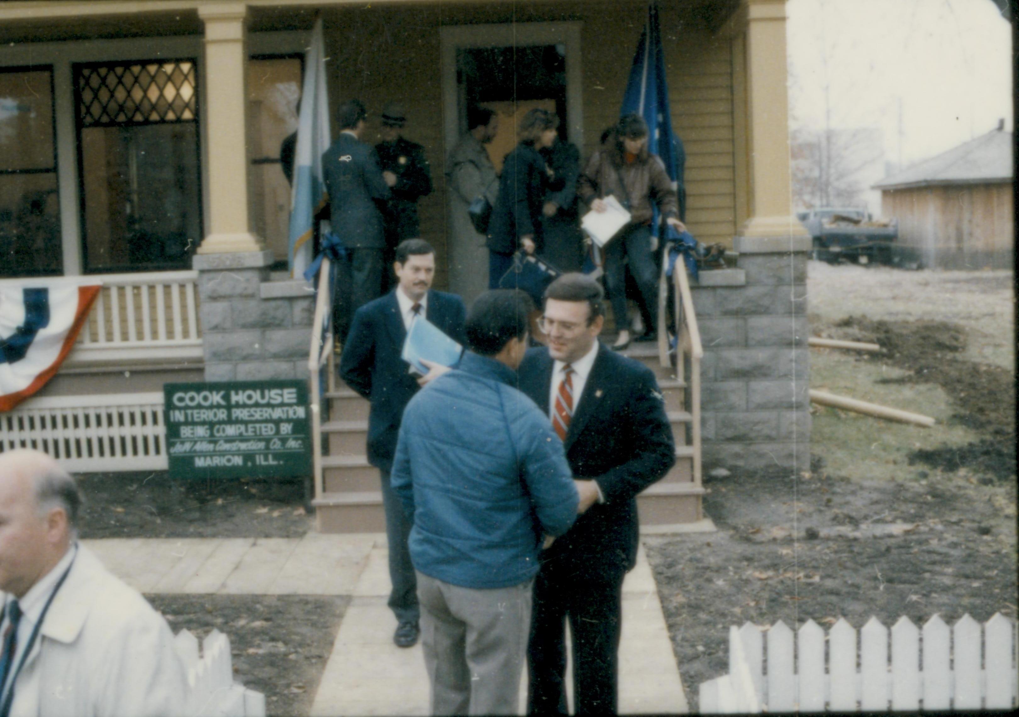 Visitors on porch and in front of house. Lincoln Home NHS- Cook House Re-opening, 2 Cook, ceremony