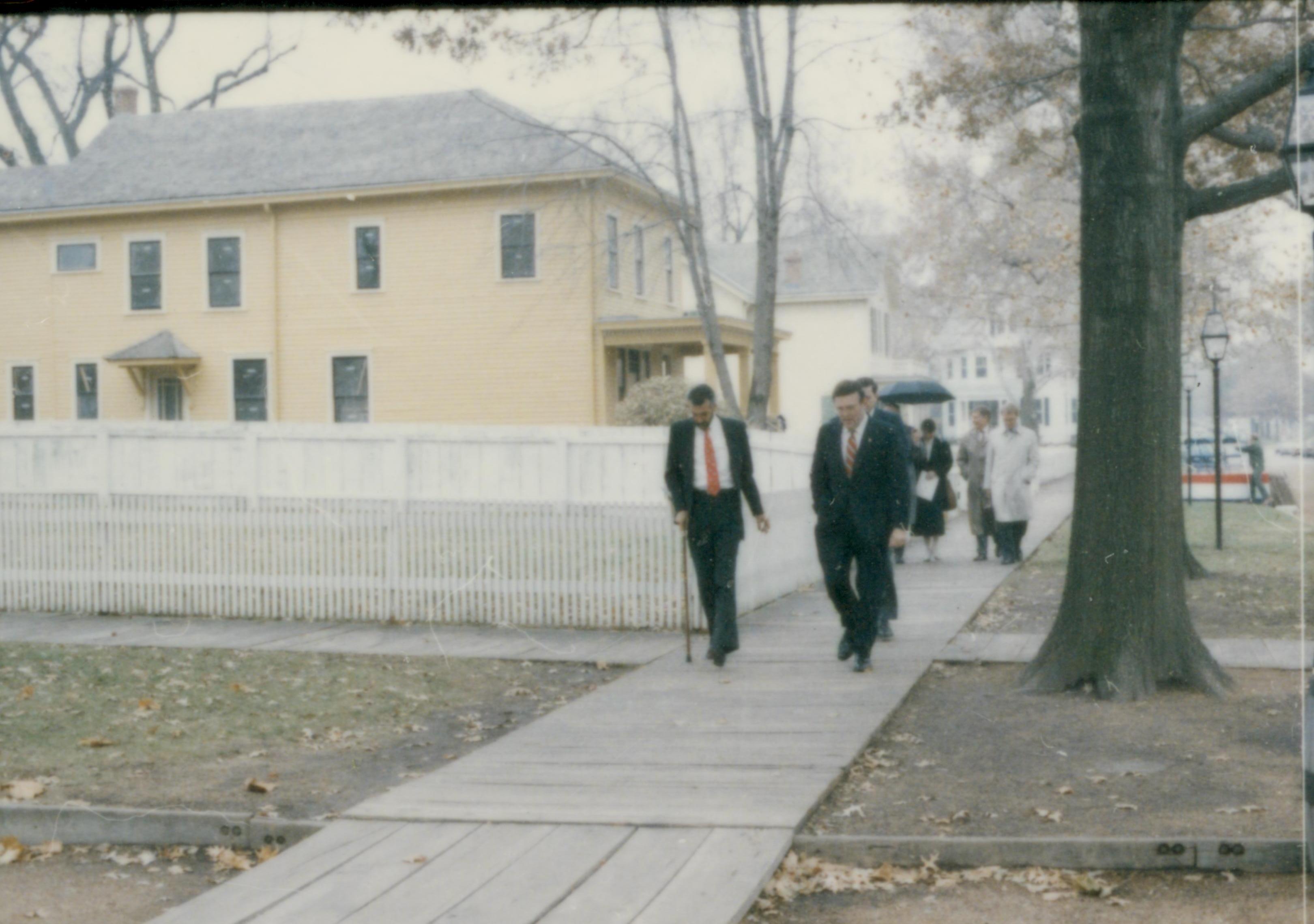 People walking down board walk from Cook house. Lincoln Home NHS- Cook House Re-opening, 2 Cook, ceremony, tour