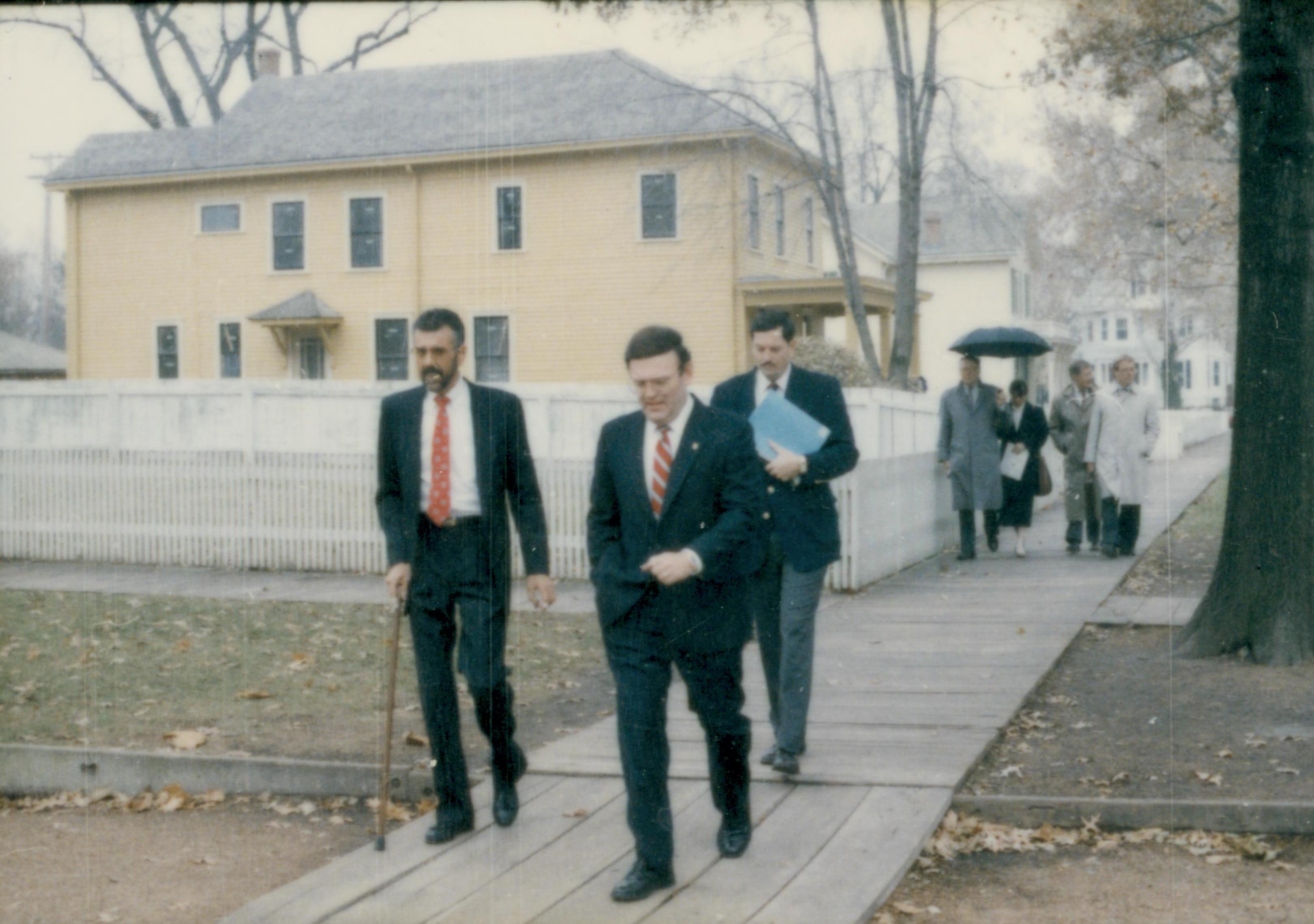 People walking down board walk from Cook house. Lincoln Home NHS- Cook House Re-opening, 2 Cook, ceremony, tour