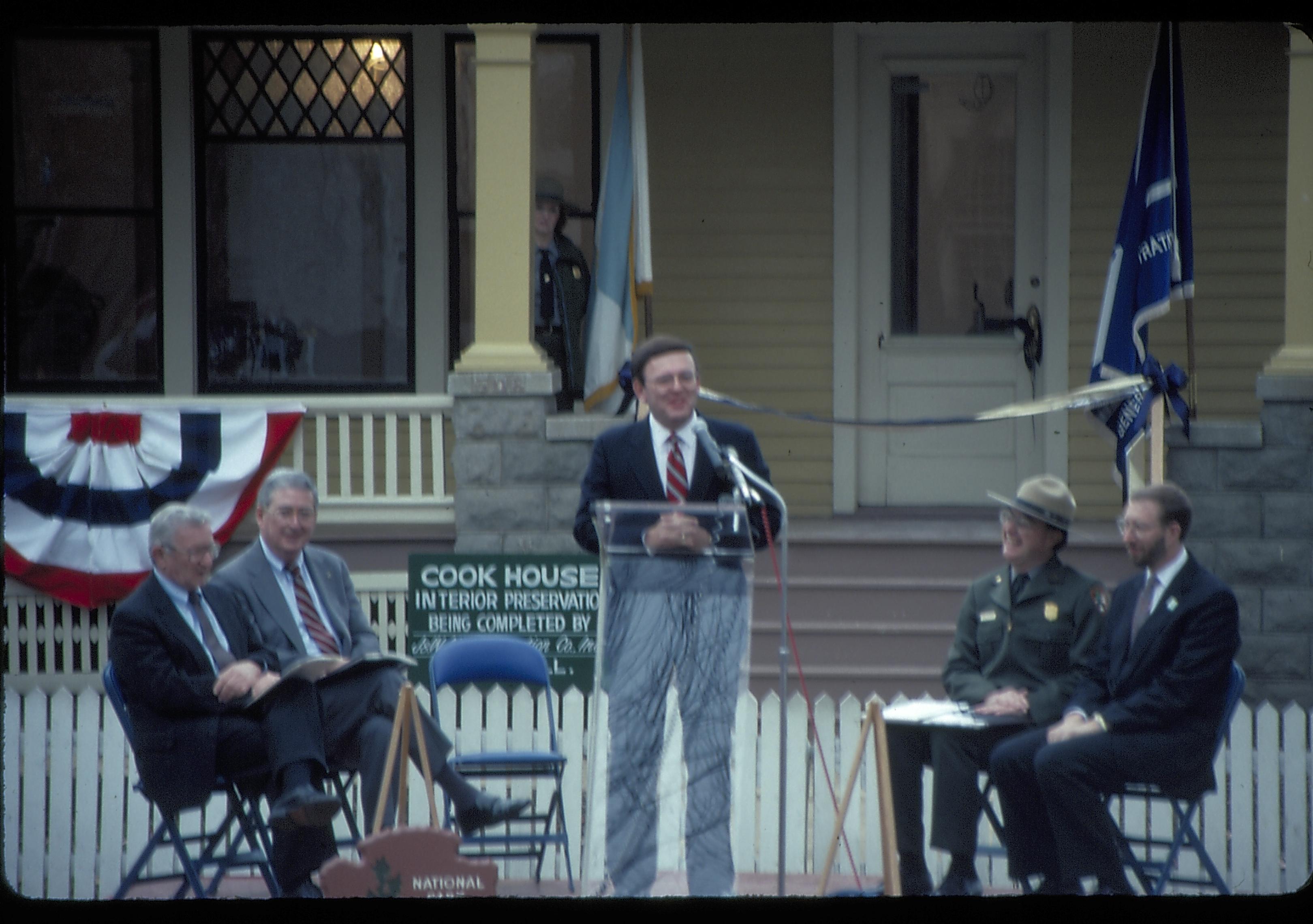 Five men on speakers platform in front of Cook house Lincoln Home NHS- Cook House Re-opening  Cook, ceremony