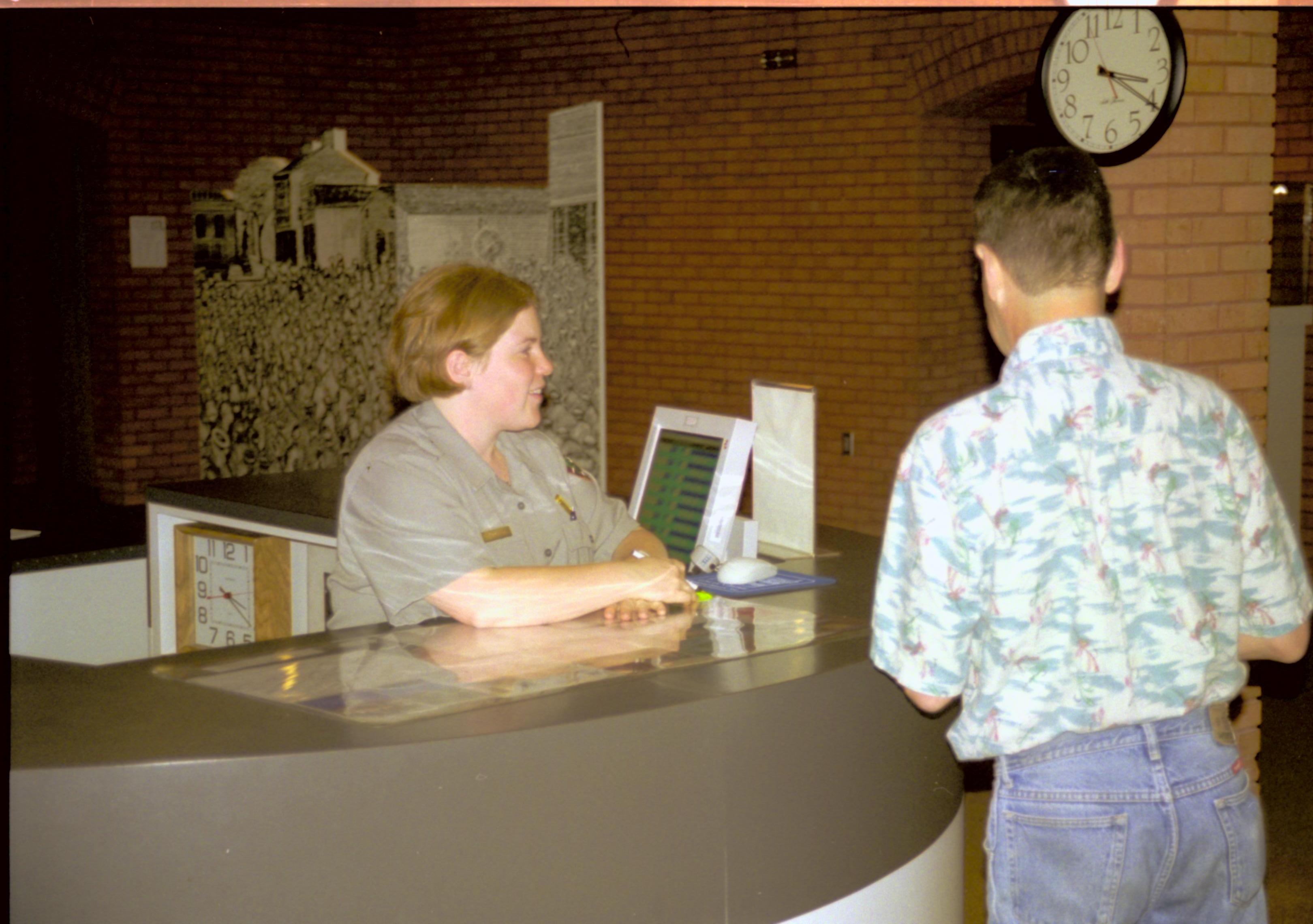 Visitor at information desk with ranger. Lincoln Home NHS- C-SPAN, 614499 C-SPAN, Visitor Center