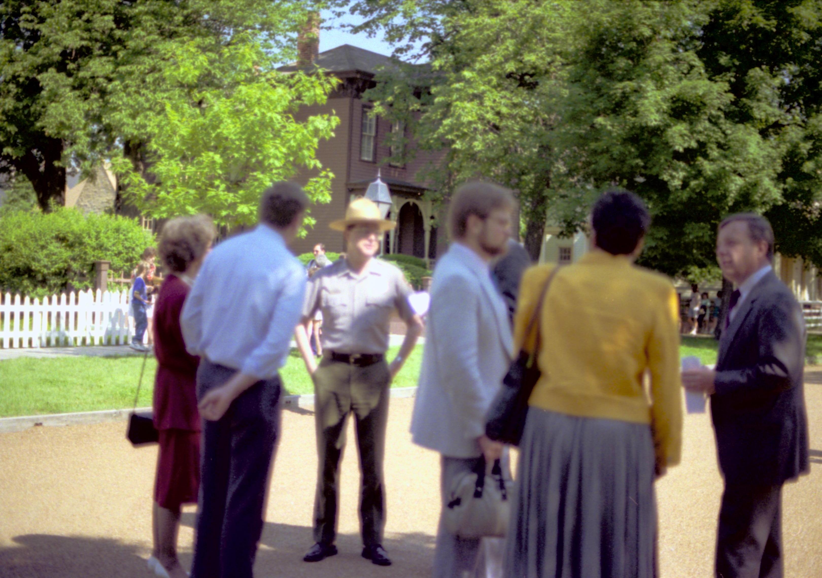 Ranger and people standing around. Lincoln Home NHS- Durbin, 24C, artifact #744 tour, conference