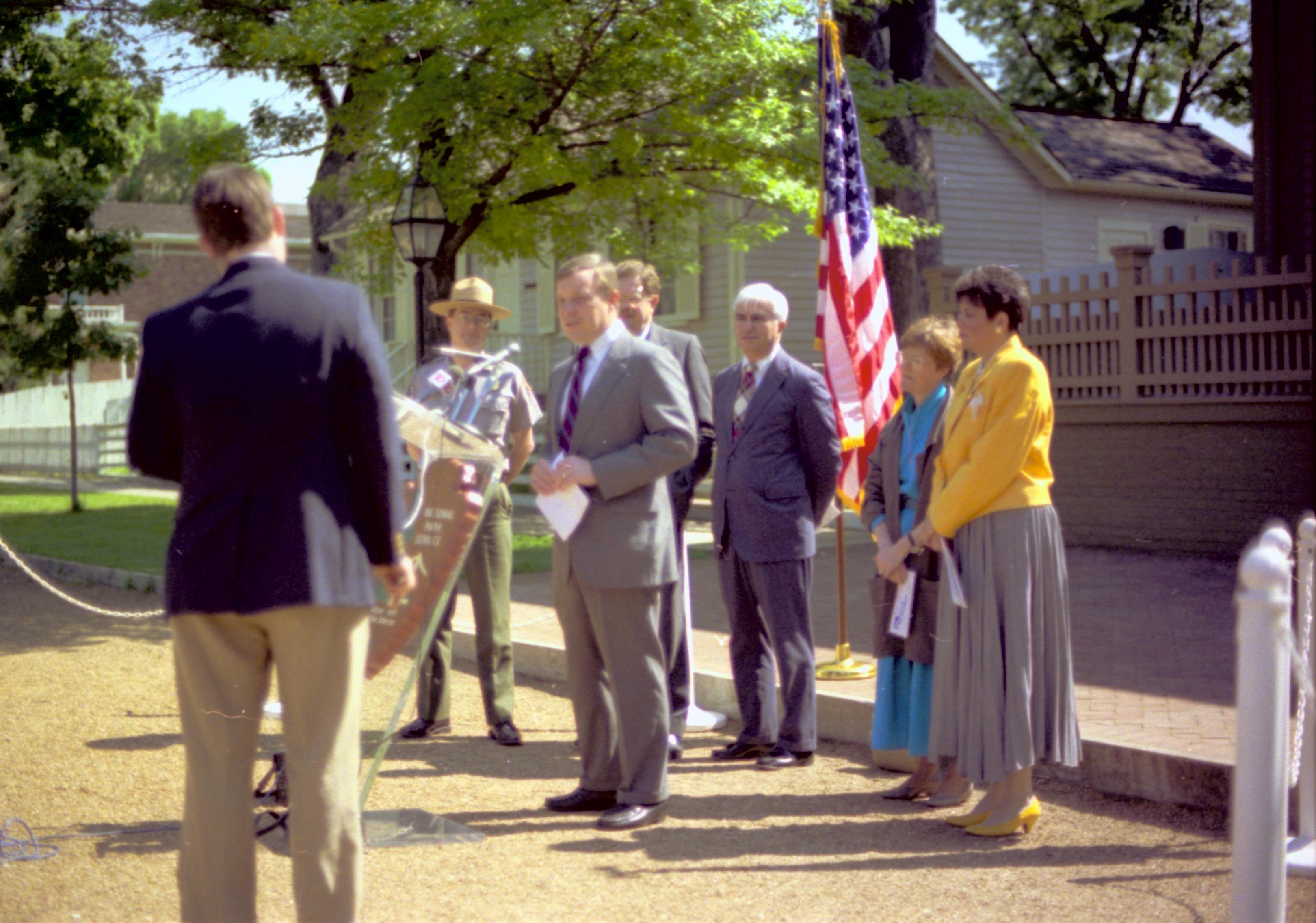 Man speaking with others standing behind. Lincoln Home NHS- Durbin, 24C, artifact #744 press, conference