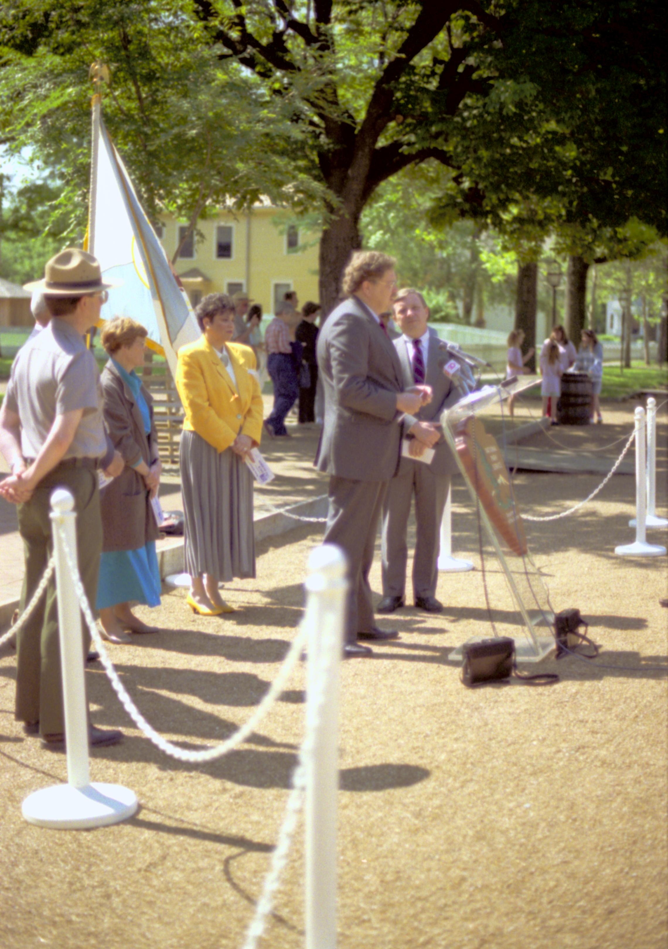 Man speaking with others standing behind. Lincoln Home NHS- Durbin, 24C, artifact #744 press, conference, interview