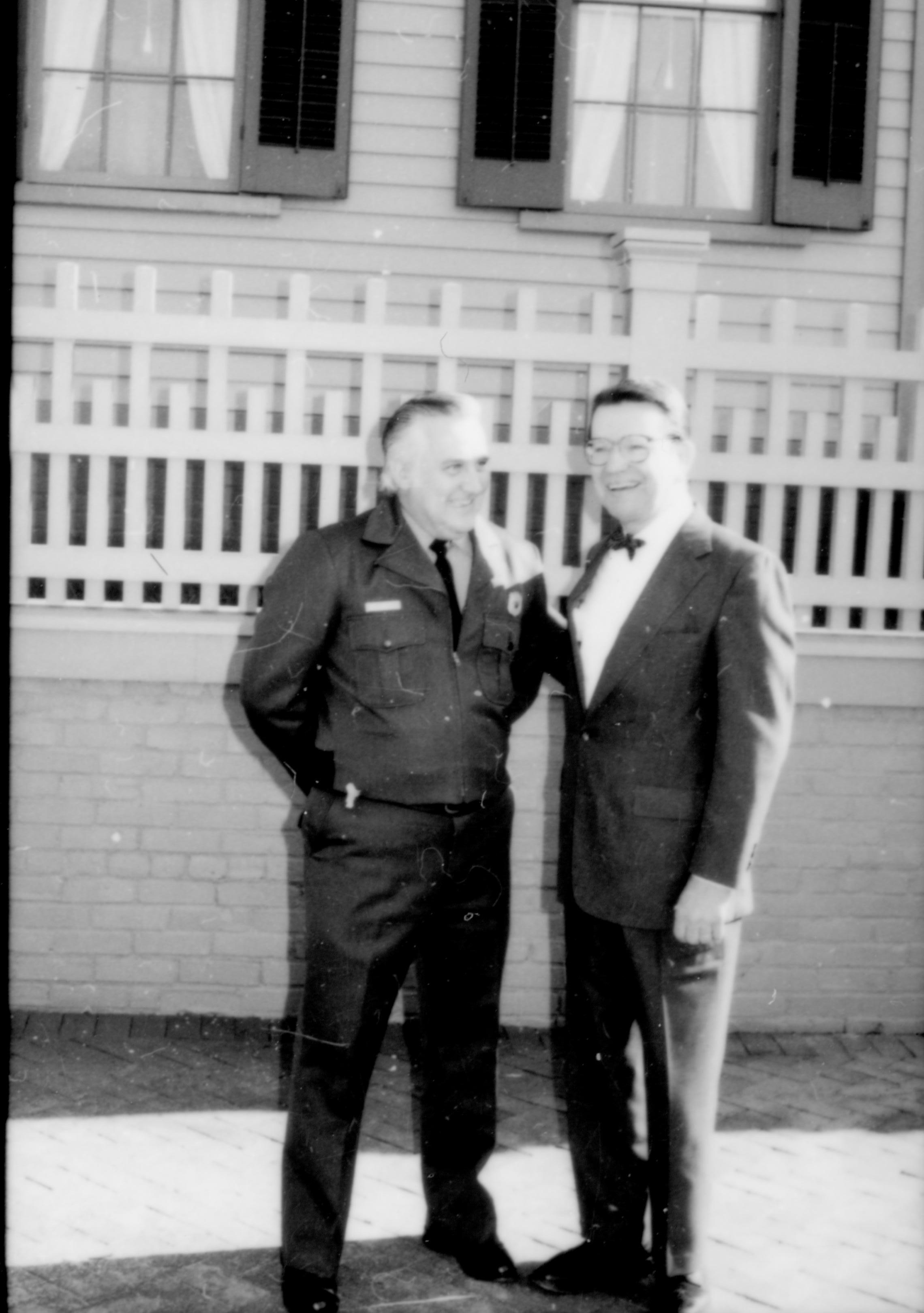 Ranger and man standing in front of brick wall. Lincoln Home NHS- Durbin and Simon, 77 Durbin, Simon, visit, media