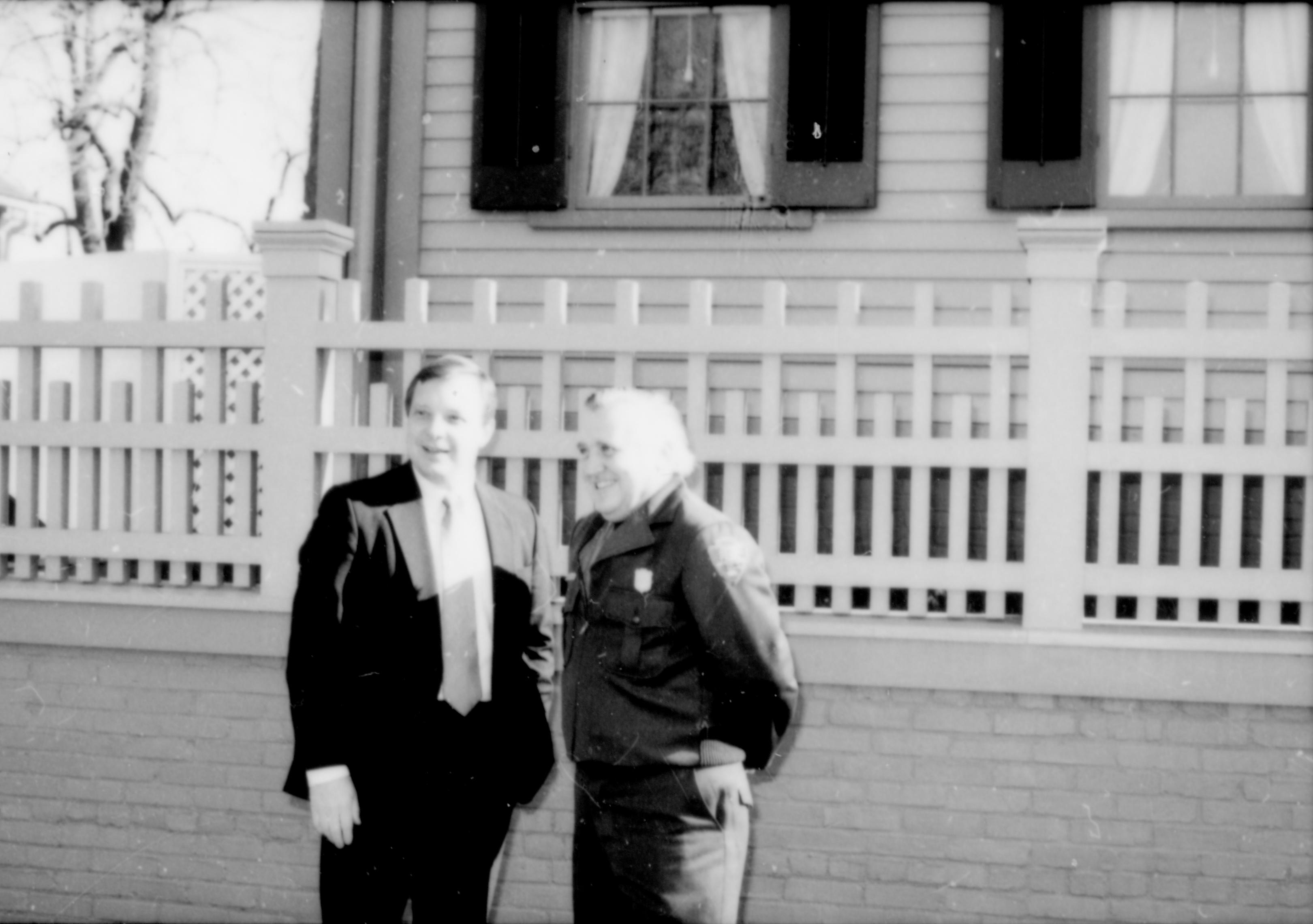 Two men in front of fence. Lincoln Home NHS- Durbin and Simon, 77 Durbin, Simon, visit, media