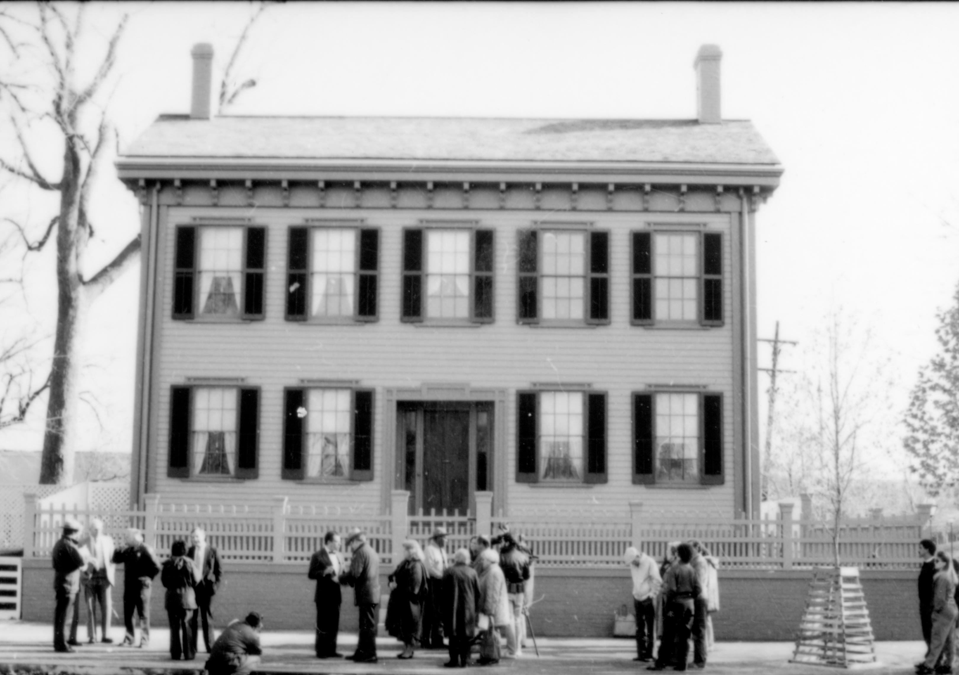 Front of Lincoln home, people on sidewalk. Lincoln Home NHS- Durbin and Simon, 77 Durbin, Simon, visit, media