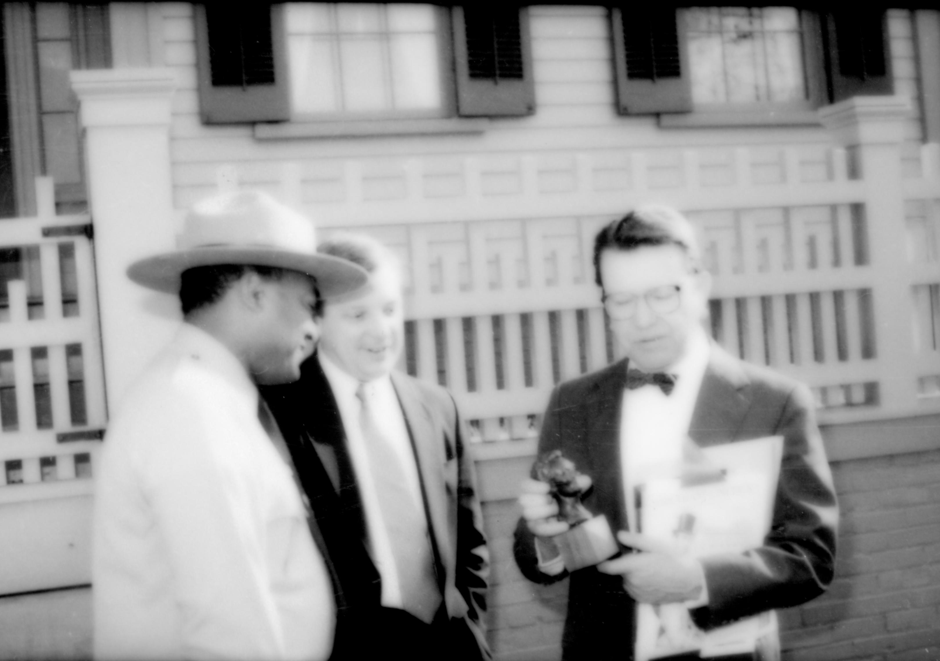 Three men , one holding Lincoln sculpture. Lincoln Home NHS- Durbin and Simon, 77 Durbin, Simon, visit