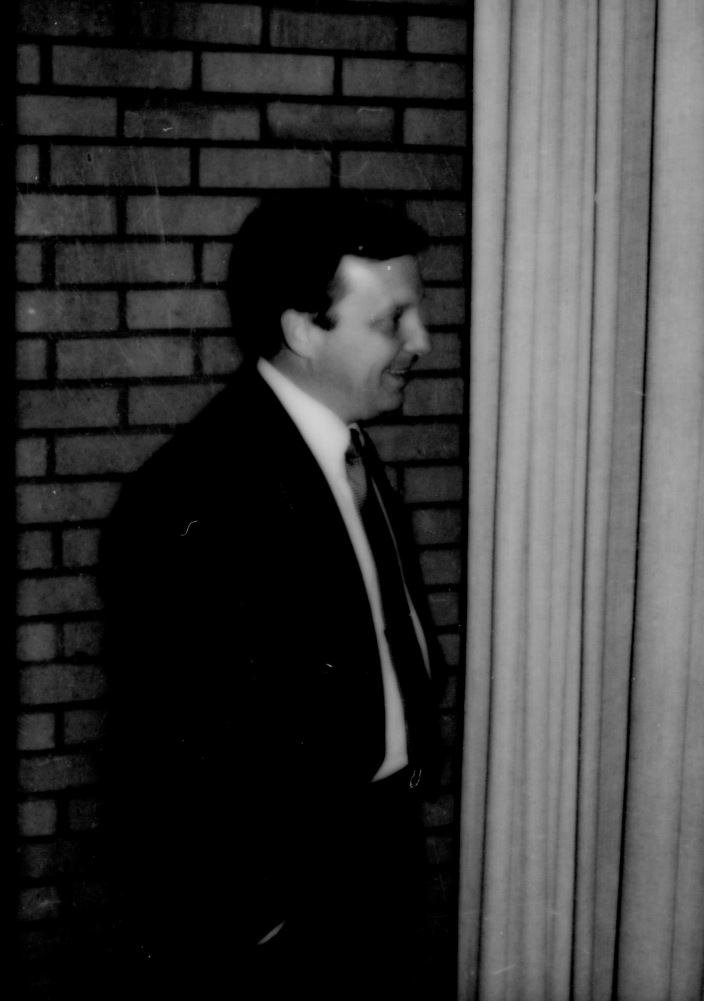 Man standing in front of brick wall& curtin. Lincoln Home NHS- Durbin and Simon, 78 Durbin, Simon, visit