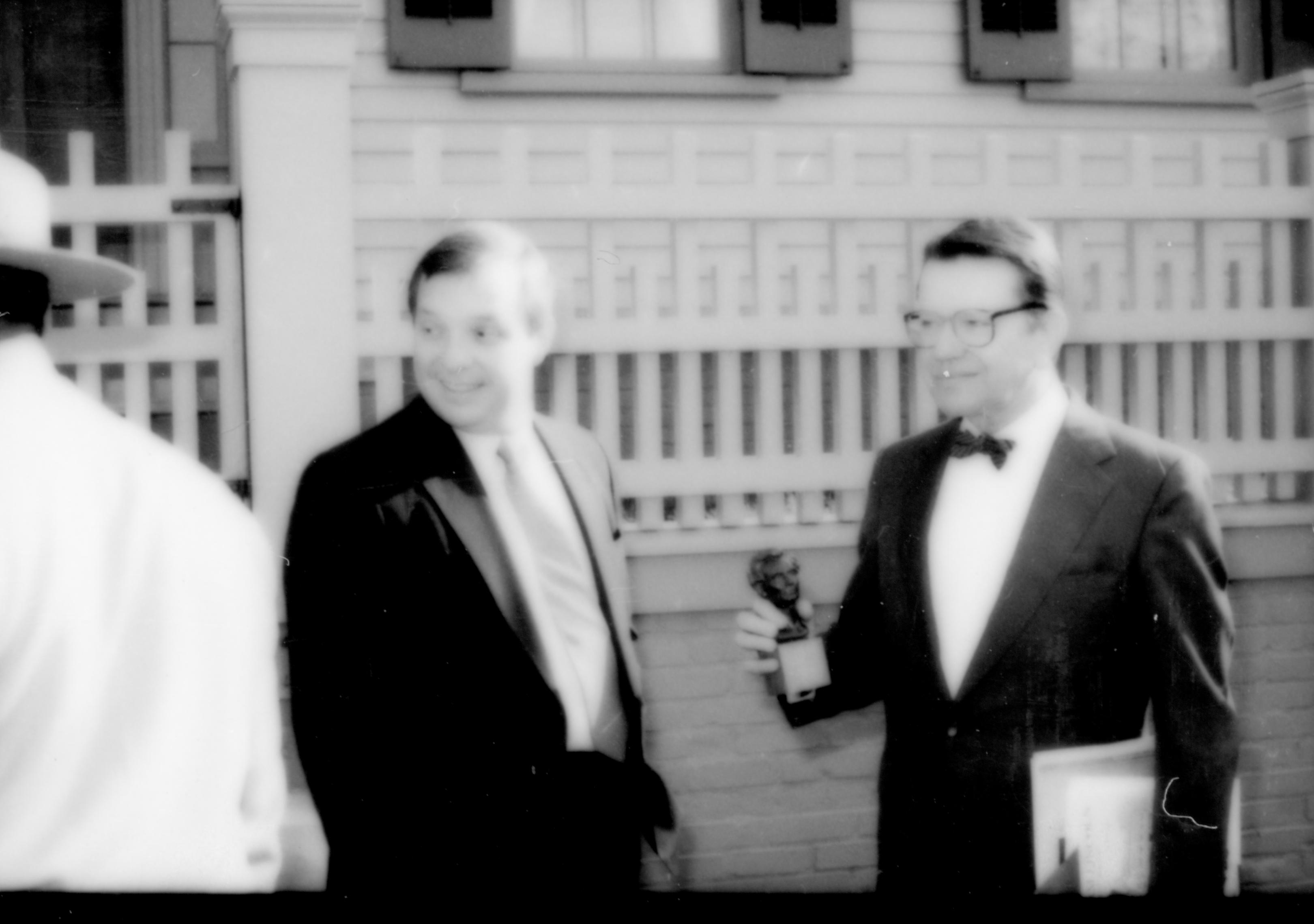 Richard Durbin and U. S. Senator Paul Simon (holding Lincoln head) Lincoln Home NHS- Durbin and Simon, 77 Durbin, Simon, visit